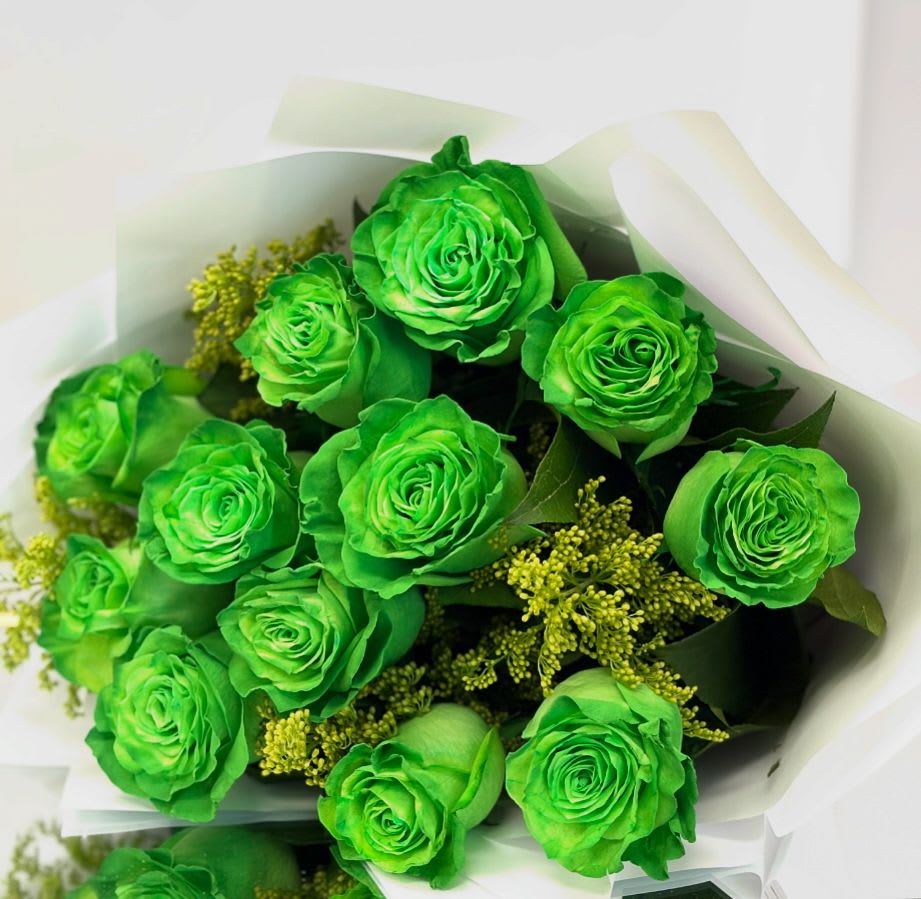 Emerald Whisper By VLM Flowers Emerald Whisper By VLM Flowers - A captivating bouquet of vivid green roses, Emerald Whisper is a rare and enchanting gift. Paired with delicate yellow-green fillers and wrapped in crisp white paper, this arrangement radiates freshness, originality, and good fortune. Perfect for someone who dares to stand out — or to bring a unique, energizing twist to a celebration, congratulations, or modern gesture of love.