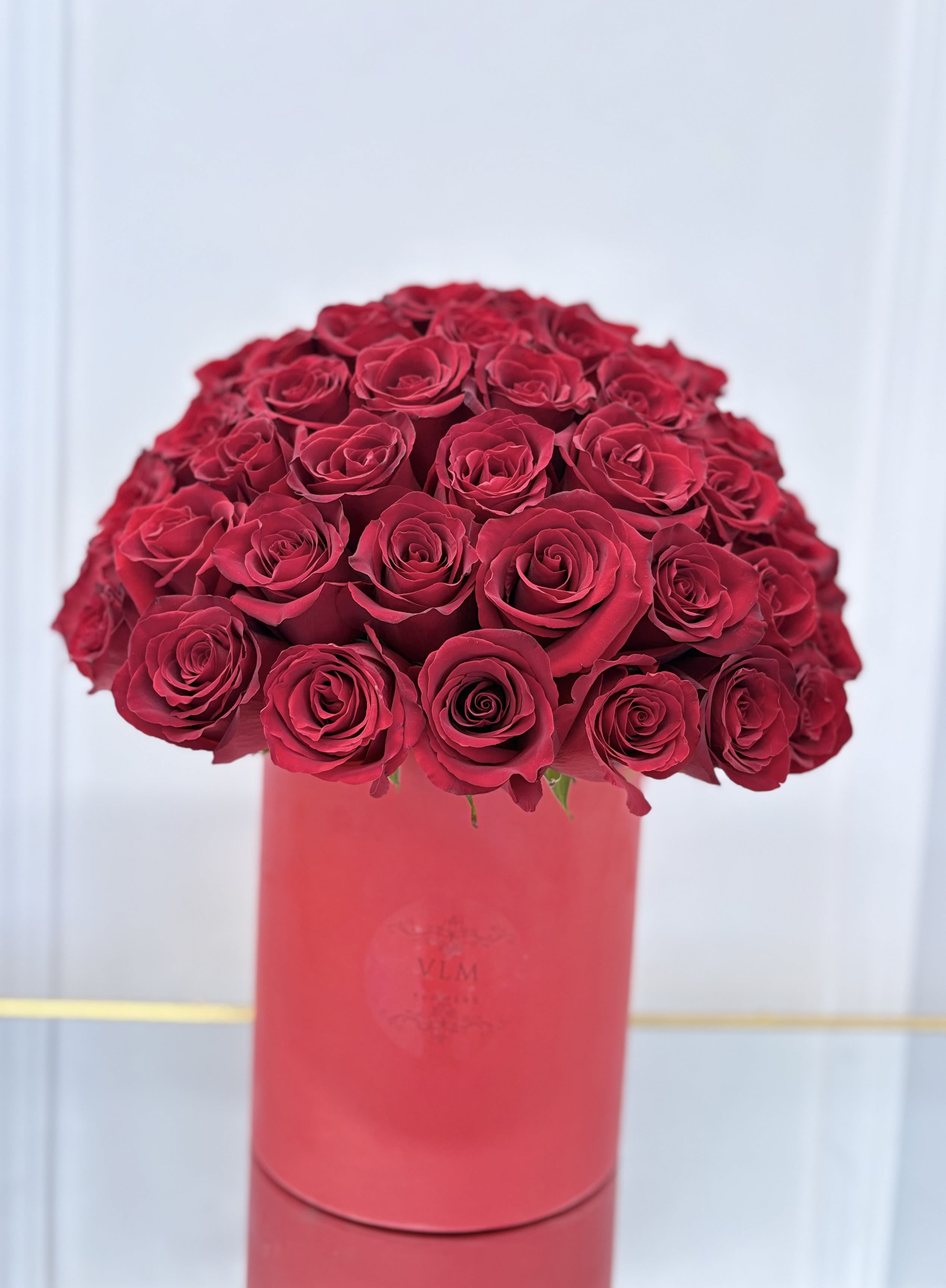 Red Rose Hat Box By VLM Flowers - Red Rose Hat Box By VLM Flowers is the most romantic box. It can be the best gift for your loved ones. This hat Box will surely bring some spark of love into the relationship.