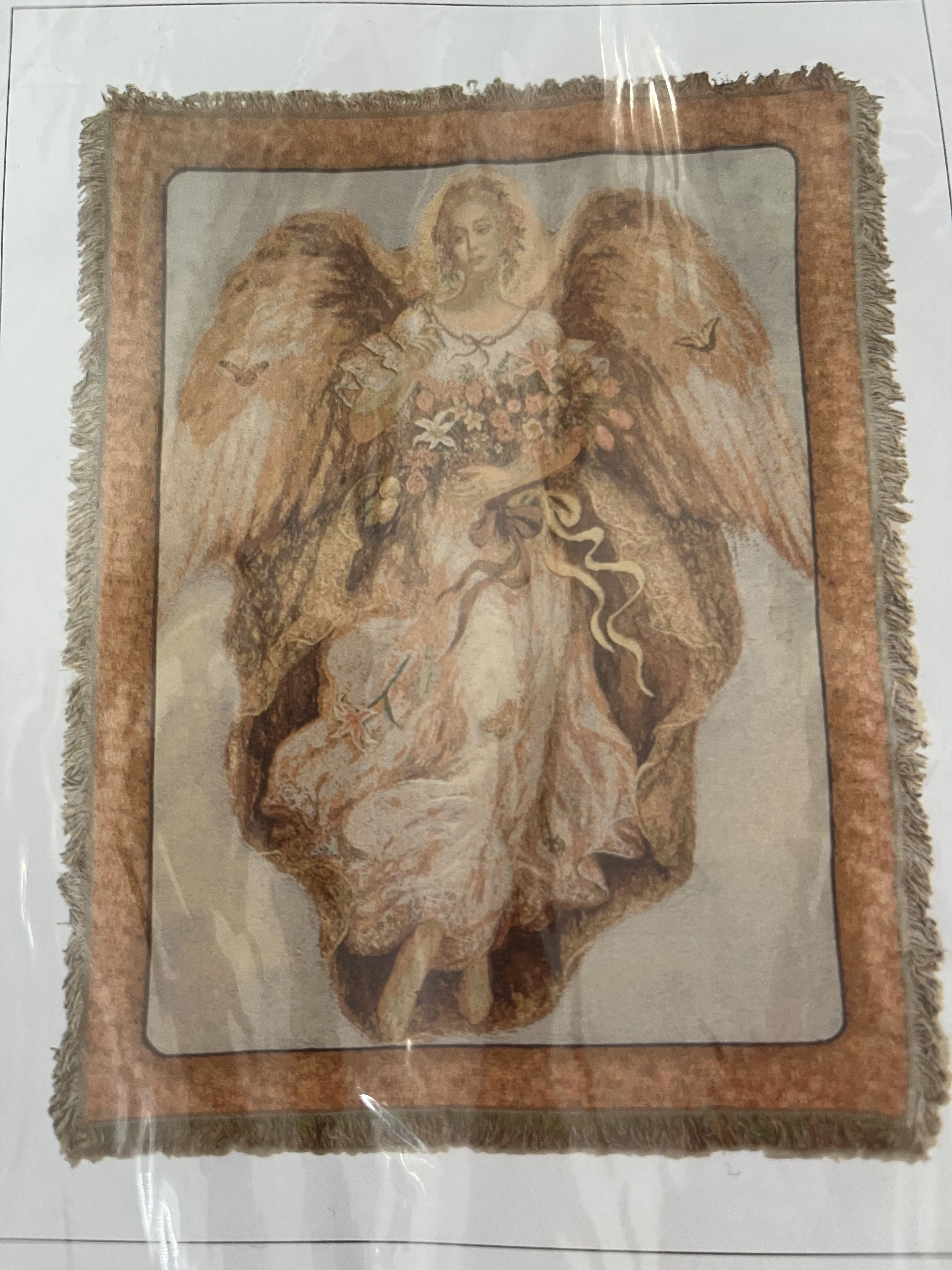 Angel Tapestry Throw Angel Tapestry Throw - The Deluxe option comes with a $15 metal easel for the blanket to stand up on and be seen with a bow. If you decide to go with the Standard option, the blanket will come folded with a bow. A beautiful tapestry that makes the perfect memorial gift for a family member, close friend, or loved one.