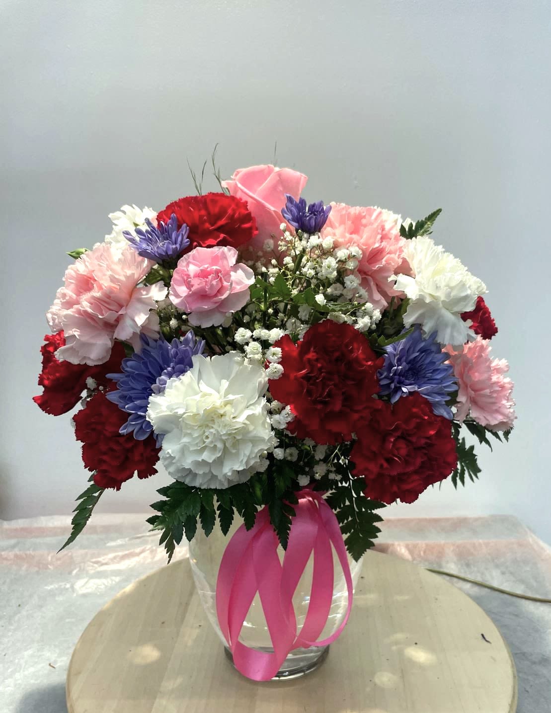 Cotton Candy (with pink Roses) - Soft and divinely delicate, this perfect pastel bouquet is pretty as can be. Delivered in a classic ginger jar, the graceful arrangement of   carnations, Roses Mom's.   welcome surprise on any occasion. 