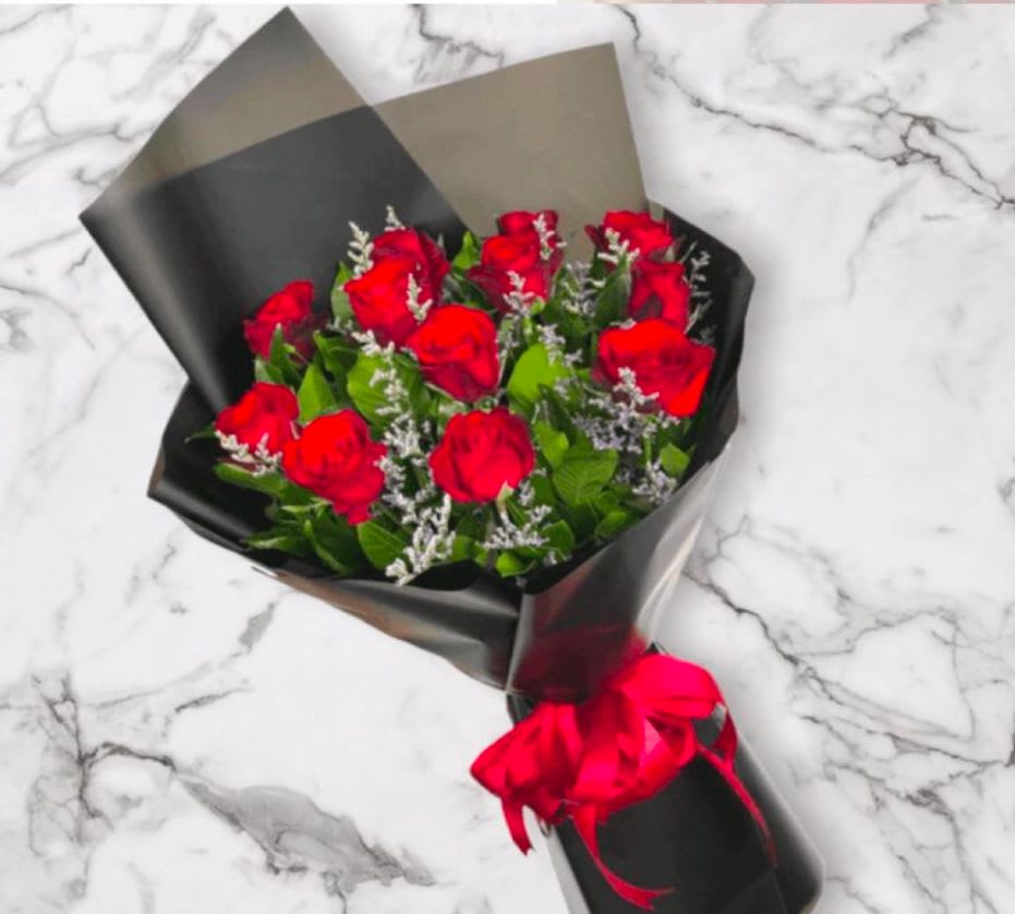 Lovely Romance Lovely Romance - Beautiful red roses wrapped in paper bouquet