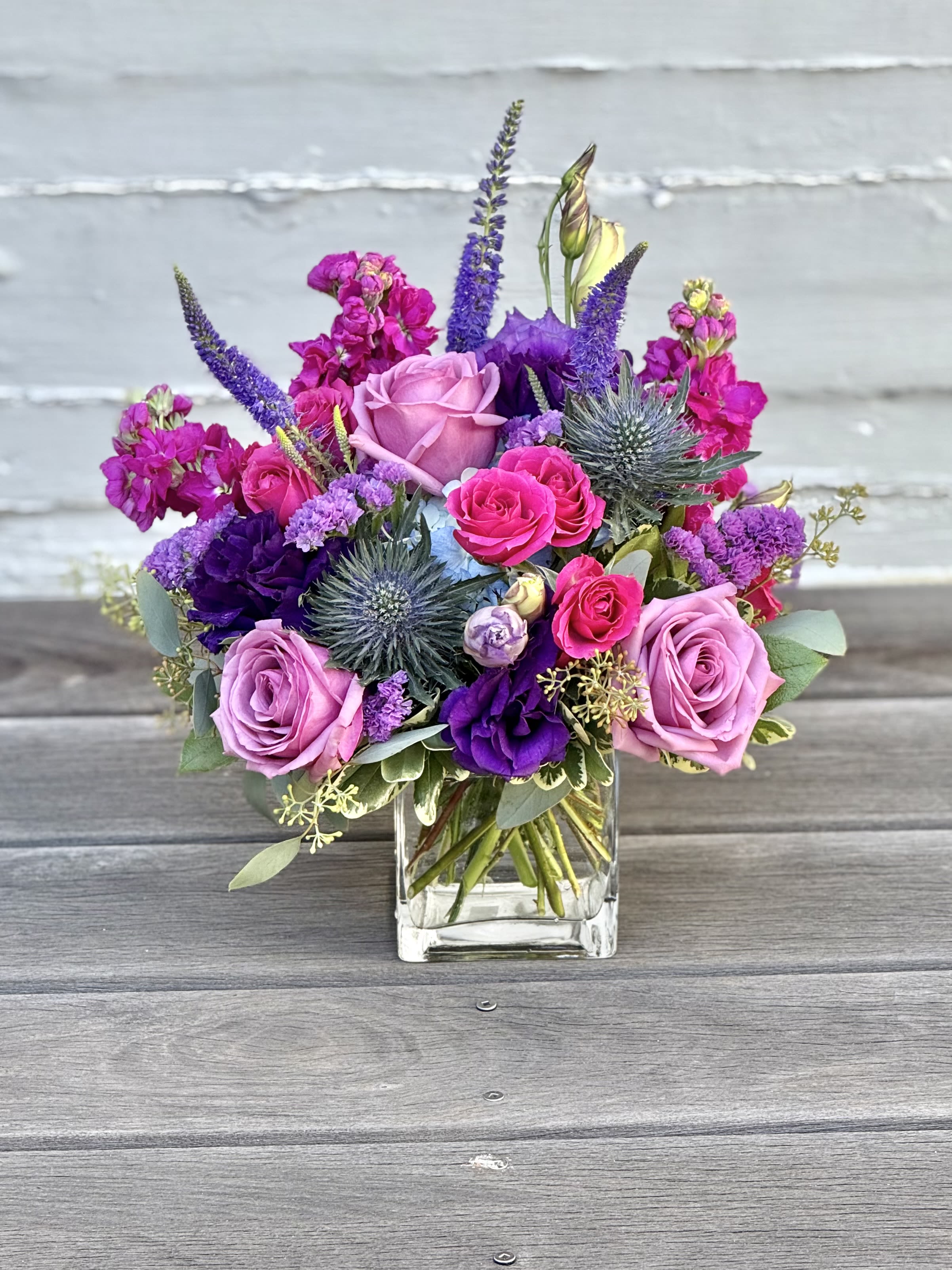 Very Berry - Our Very Berry bouquet featuring blue hydrangea, thistle, lisianthus, fragrant stock and roses.