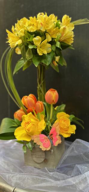 Floral Topiary - Make a real splash this Mother's Day by gifting them a beautiful custom floral topiary!  Bright and colorful, complete with a butterfly in a reusable wooden box....  Please note that colors will vary and that each topiary is an individual designer creation.