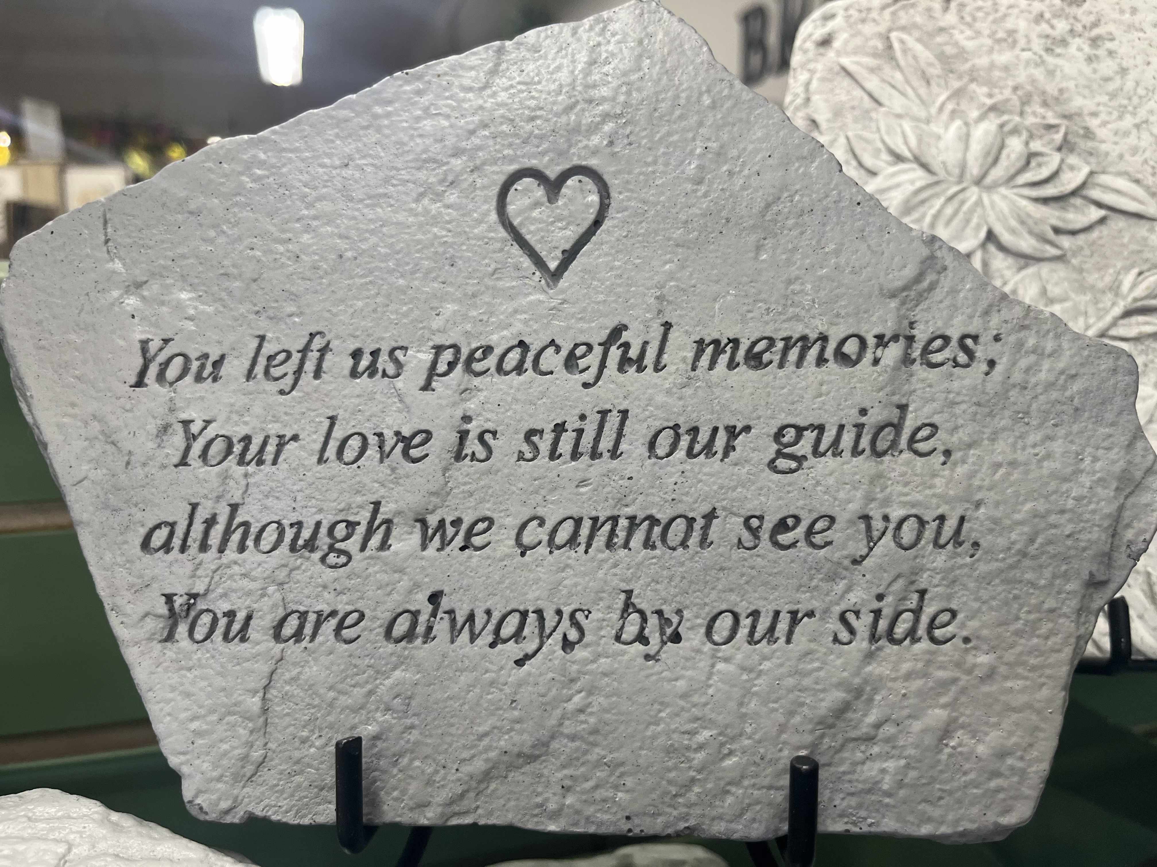 Always By Our Side Stone Always By Our Side Stone - This medium sized stone features the saying, "You left us peaceful memories; Your love is still our guide, although we cannot see you, You are always by our side" with a small engraved heart. Easel is included in purchase.