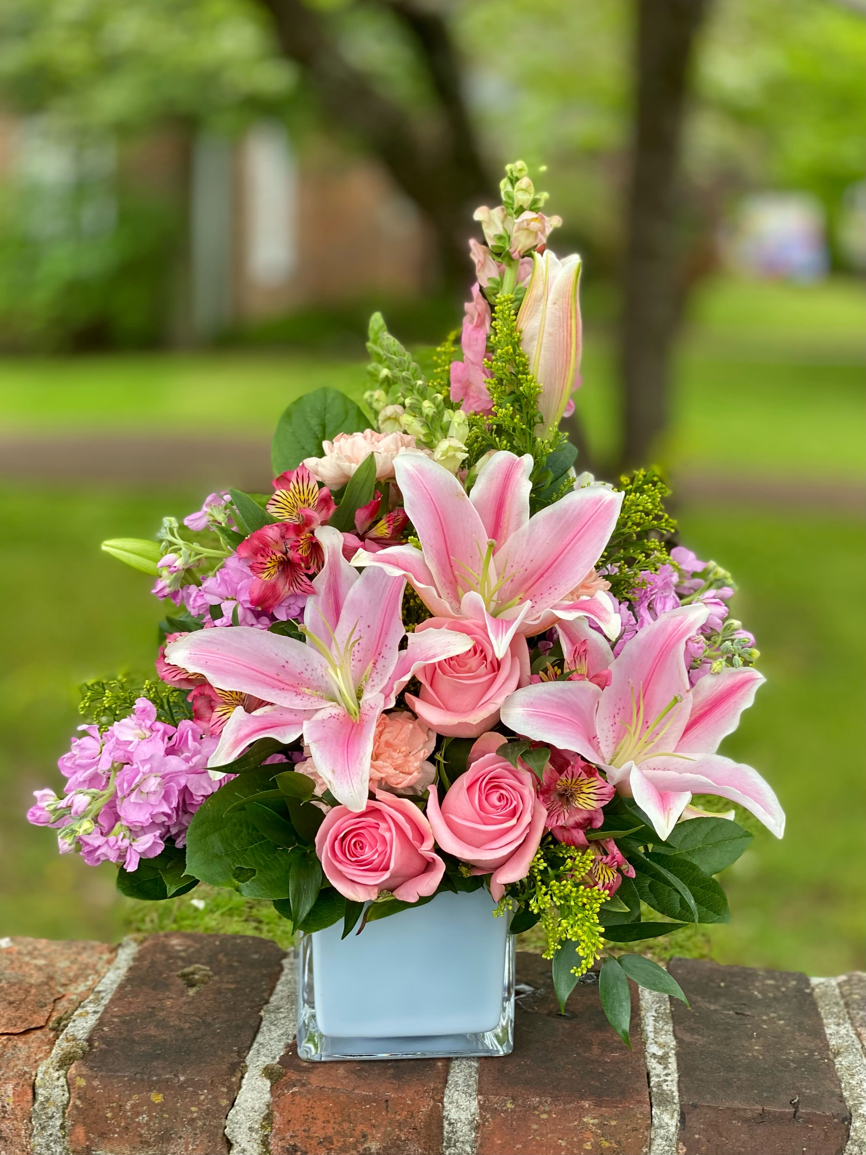 Colorful Celebration Basket - An arrangement full of beautiful flowers that is sure to brighten any occasion!