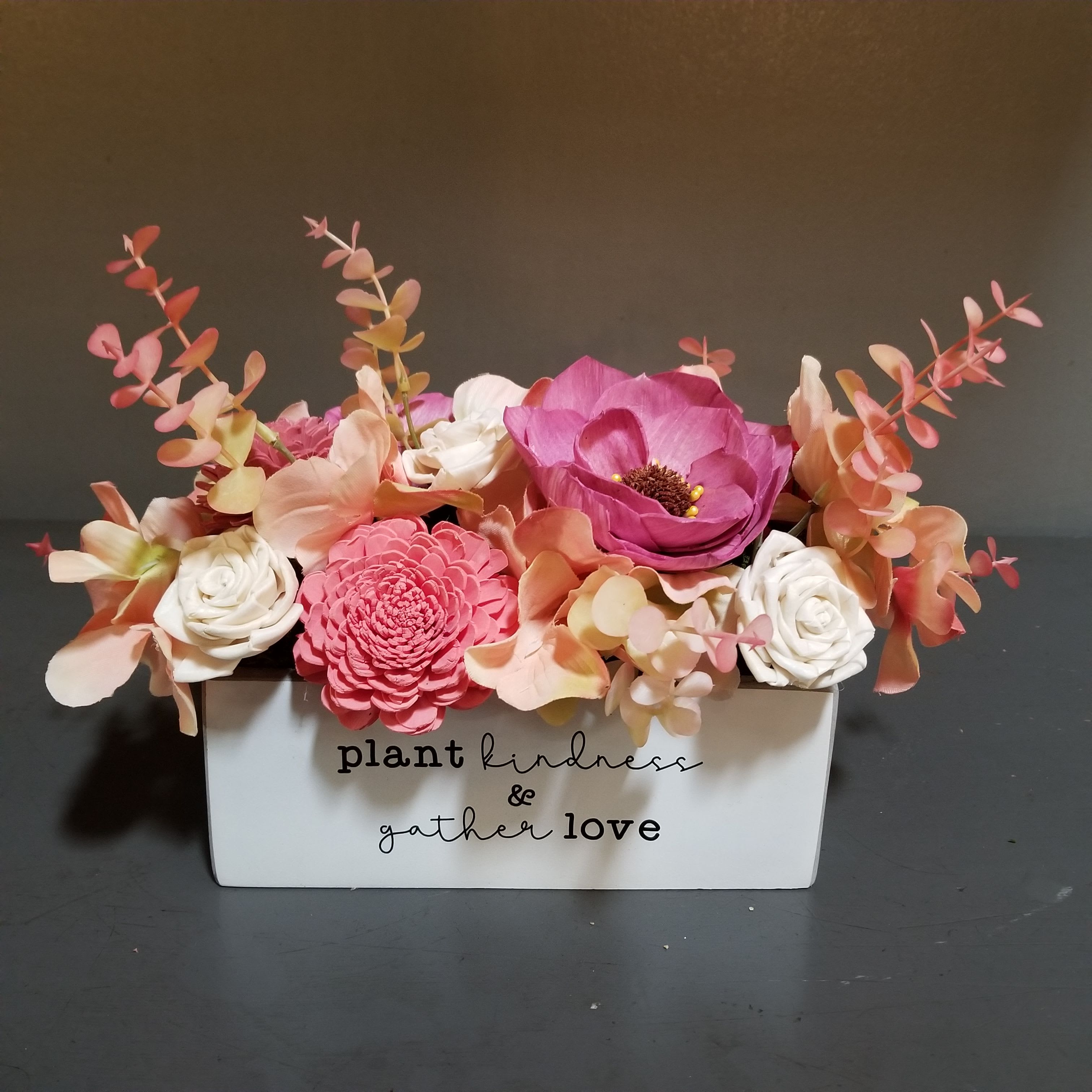 Sola Wooden Flower Centerpiece - Plant Kindness, Gather Love - Hand-dyed and hand-crafted in Minneapolis, these flowers made of balsa wood are a wonderful everlasting floral arrangement - great for those with allergies! Can be used as a natural essential oil diffuser too! Approx. Dimensions: 13&quot;Wx10&quot;T in a keepsake ceramic container. 