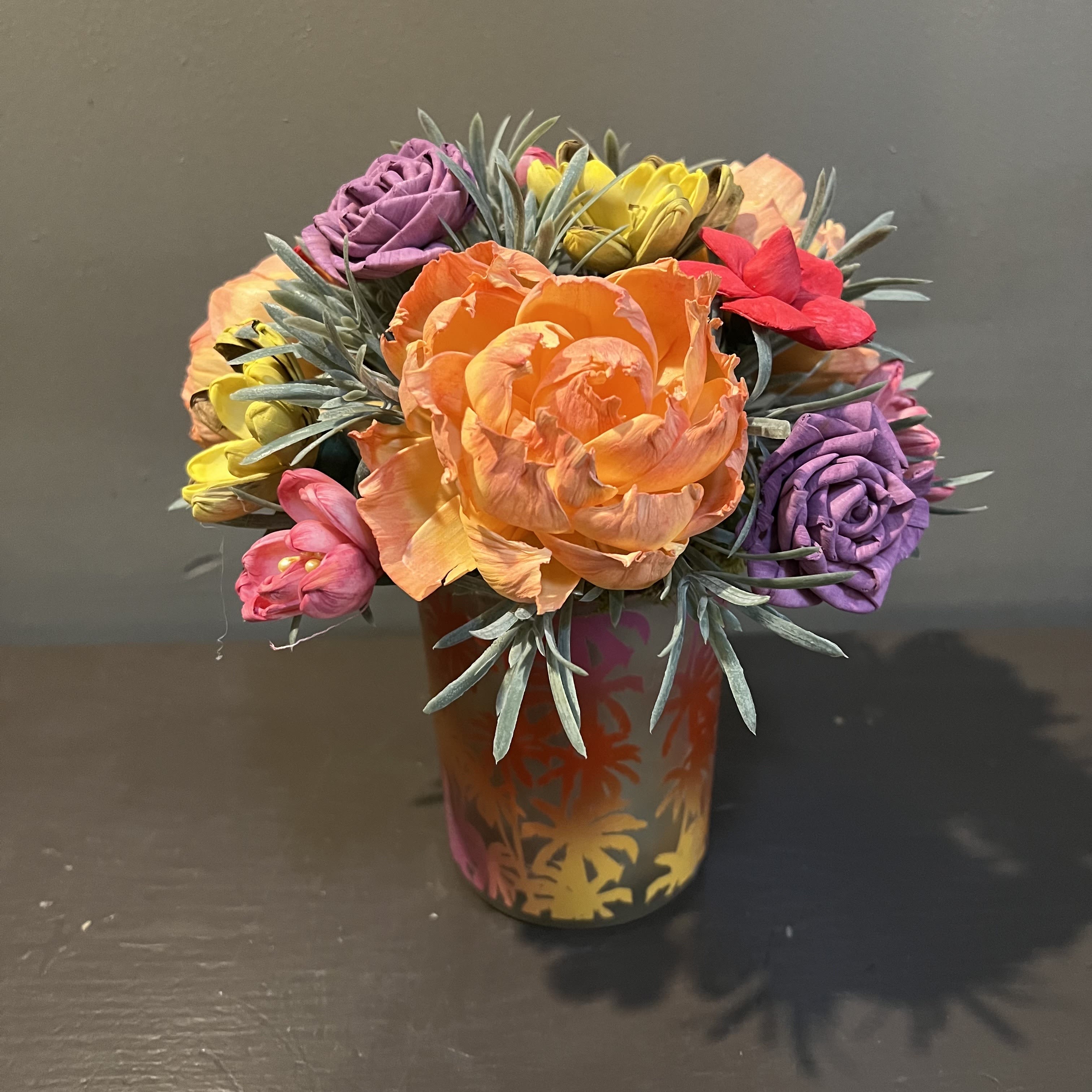 Sola Wooden Flower Centerpiece - Sunset Tropics - Hand-dyed and hand-crafted in Minneapolis, these flowers made of balsa wood are a wonderful everlasting floral arrangement - great for those with allergies! Can be used as a natural essential oil diffuser too!  Arrives in a keepsake ceramic vase. Approx. Dimensions: 10&quot;Tx9&quot;W 