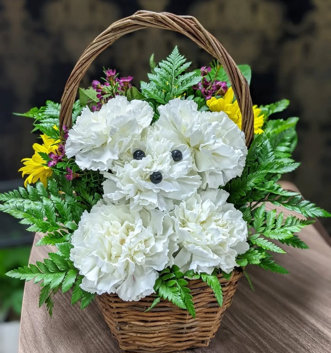Tender Expressions - Demonstrate your affection through this charming puppy basket. Arrangement features white carnation, alstroemeria and greenery. 