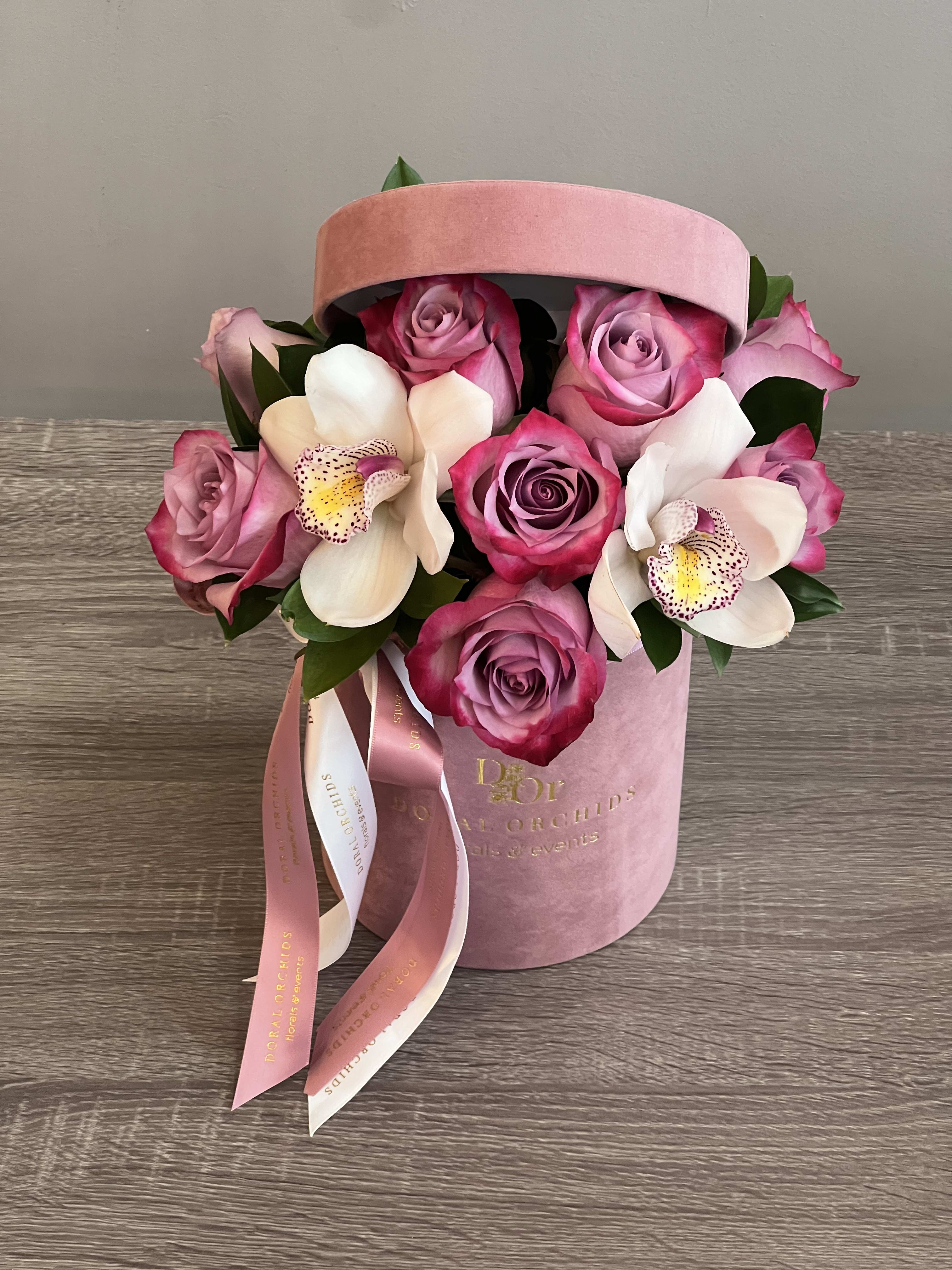 Sweet Dreams ™ Sweet Dreams ™ - Beautiful purple roses and Cymbidium orchid flowers arranged in a trendy velvet box