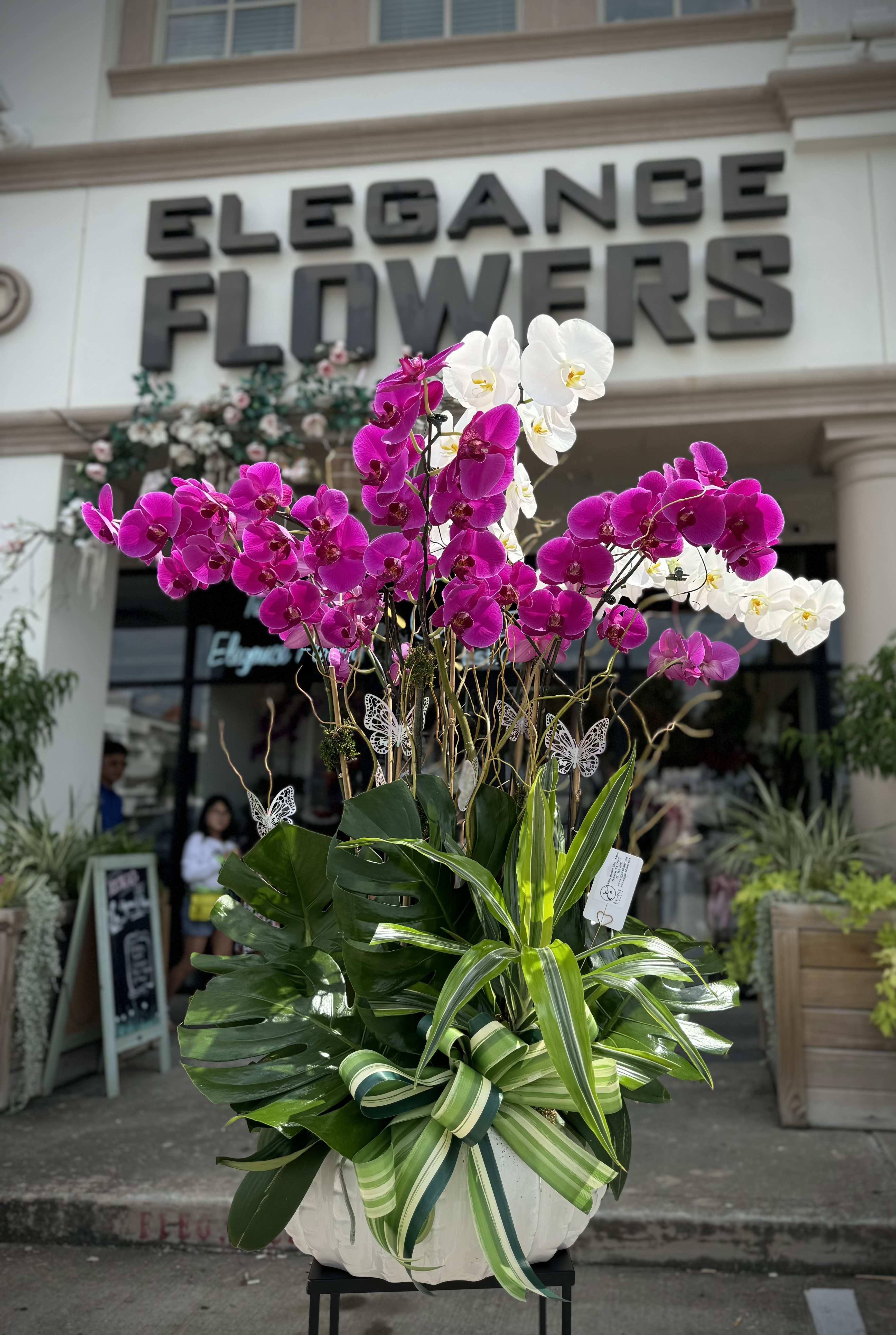 Orchid Arrangement #1 Orchid Arrangement #1 - Custom orchid arrangements feature the exotic beauty and elegance of orchids, tailored to your unique preferences. These striking blooms, known for their sophisticated appearance, can be arranged in various styles to suit any occasion or space.