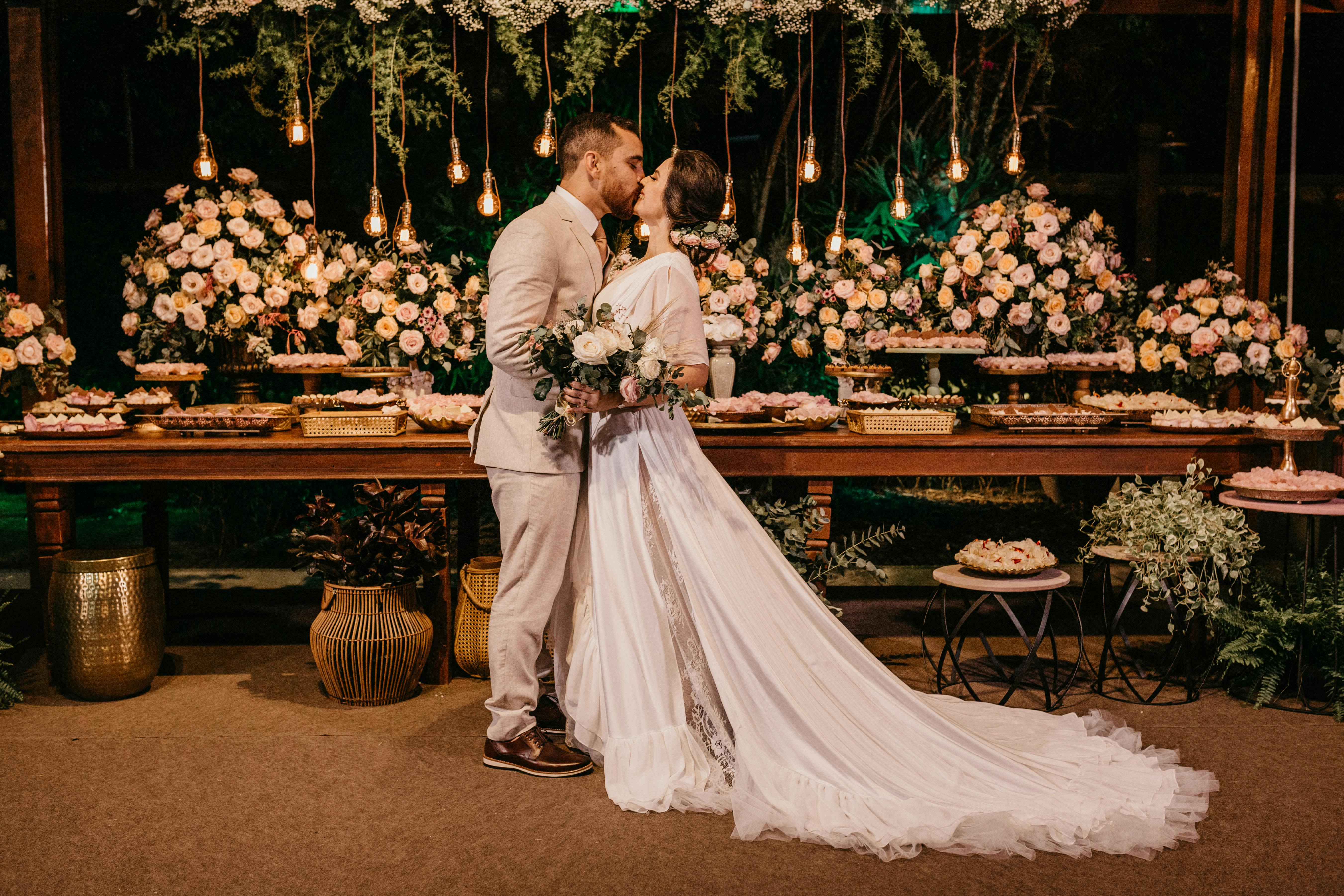 Full Bloom Experience - For couples who want it all from ceremony to reception, every floral moment is fully covered.  Includes: Personal Flowers: • 1 bridal bouquet • 6 bridesmaid bouquets • 9 boutonnieres • 2 corsages  Ceremony Decor: • Arch decoration • Chair/pew accents (10 mini bouquets) • Aisle petals (extra full)  Cocktail Hour &amp; Reception: • 6 small arrangements for cocktail tables • Sweetheart table floral piece • 10 compact centerpieces (containers included) • Cake flowers (small clusters)  Additional Details: • Welcome sign floral accent • Gift table • Memorial table • Sign-in book or seating chart florals  Also included: • Delivery &amp; on-site setup • Full wedding floral coverage
