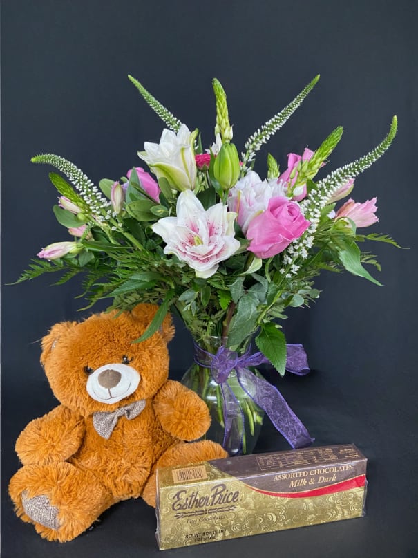 Rosy Bear! Rosy Bear! - Why give 1 gift when you can give three? This big bundle is packed with a 1/2lb box of assorted Esther Price chocolates, medium stuffed teddy bear, vase arrangement of fresh cut Roselilies, Roses, Alstroemeria, Veronicas, and Star of Bethlehem flowers