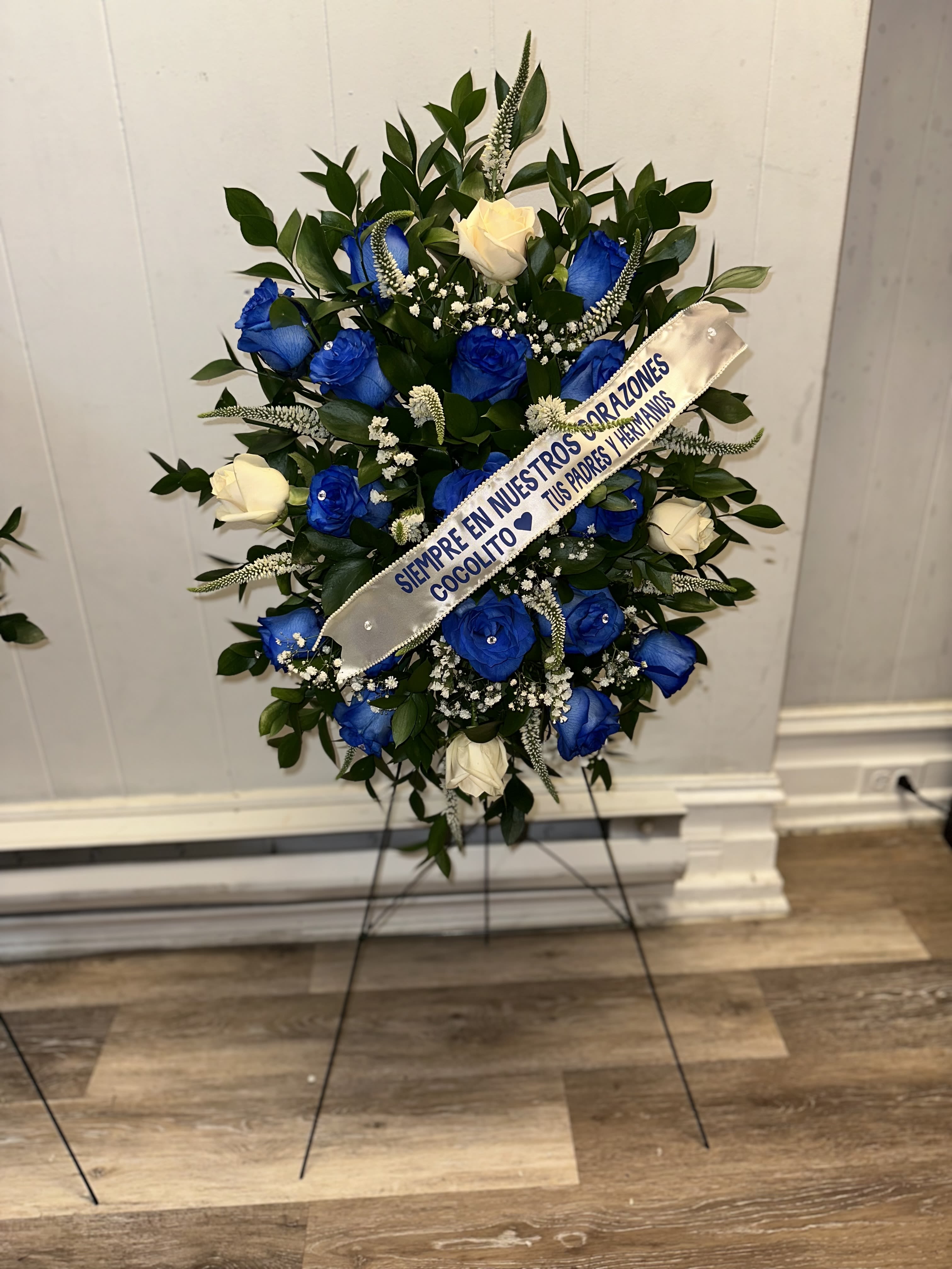 BLUE AND WHITE FUNERAL ARRANGEMENT BLUE AND WHITE FUNERAL ARRANGEMENT - BLUE AND WHITE FUNERAL ARRANGEMENT, COMES ON A GREEN METAL STAND (SIZE OF ARRANGEMENT WITH STAND APPROXIMATE 35 INC. HIGH.)