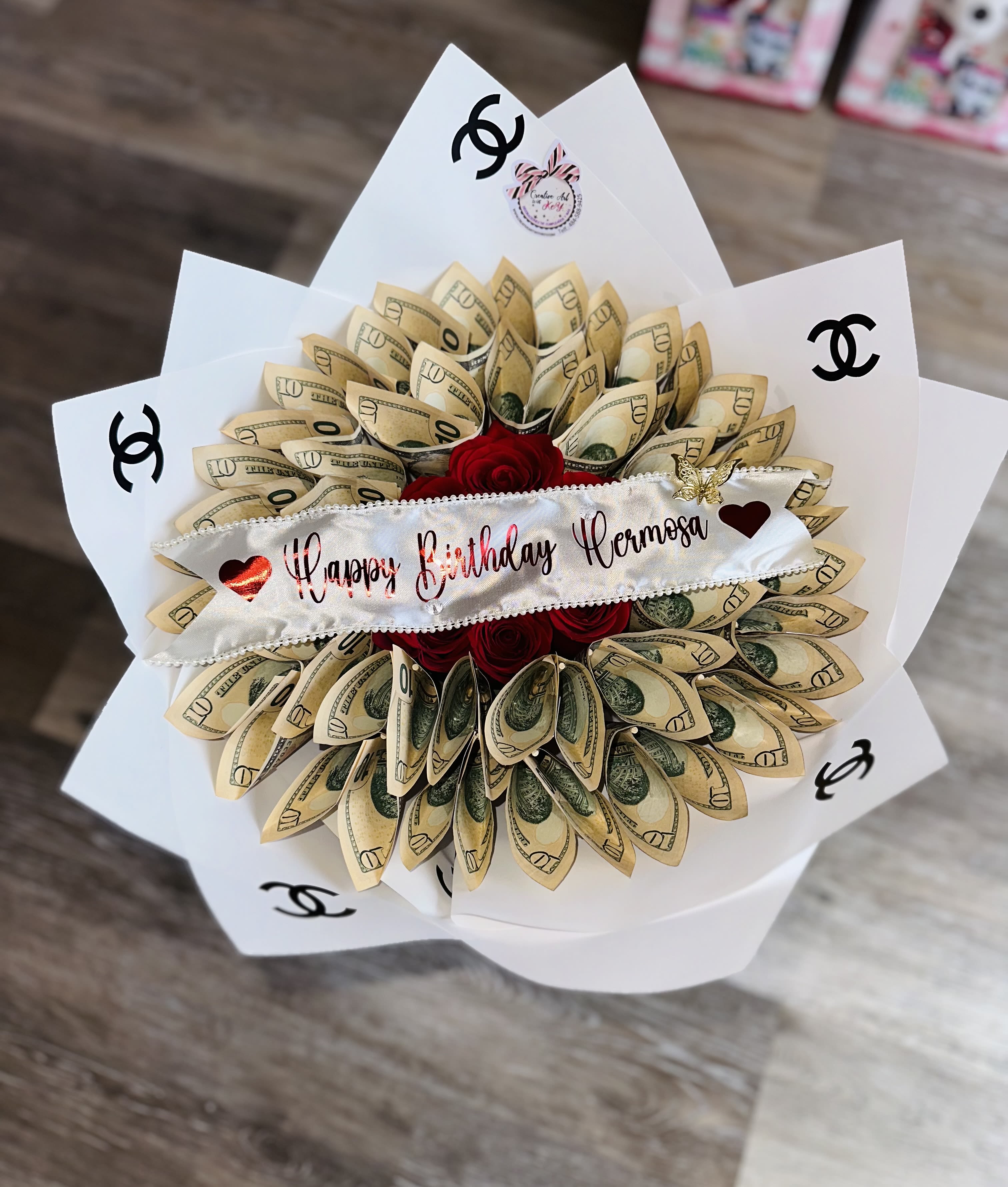 PERSONALIZED MONEY BOUQUET PERSONALIZED MONEY BOUQUET - PERSONALIZED MONEY BOUQUET, YOU CAN PERSONALIZE THE RIBBON WITH A SMALL MESSAGE OR THE NAME (SEND A TEXT TO 4845889425) YOU CAN PUT THE AMOUNT OF MONEY YOU LIKE IN THE PHOTO IT IS JUST A DESIGN OF THE STORE YOU HAVE TO CONTACT US FOR ALL THE DETAILS