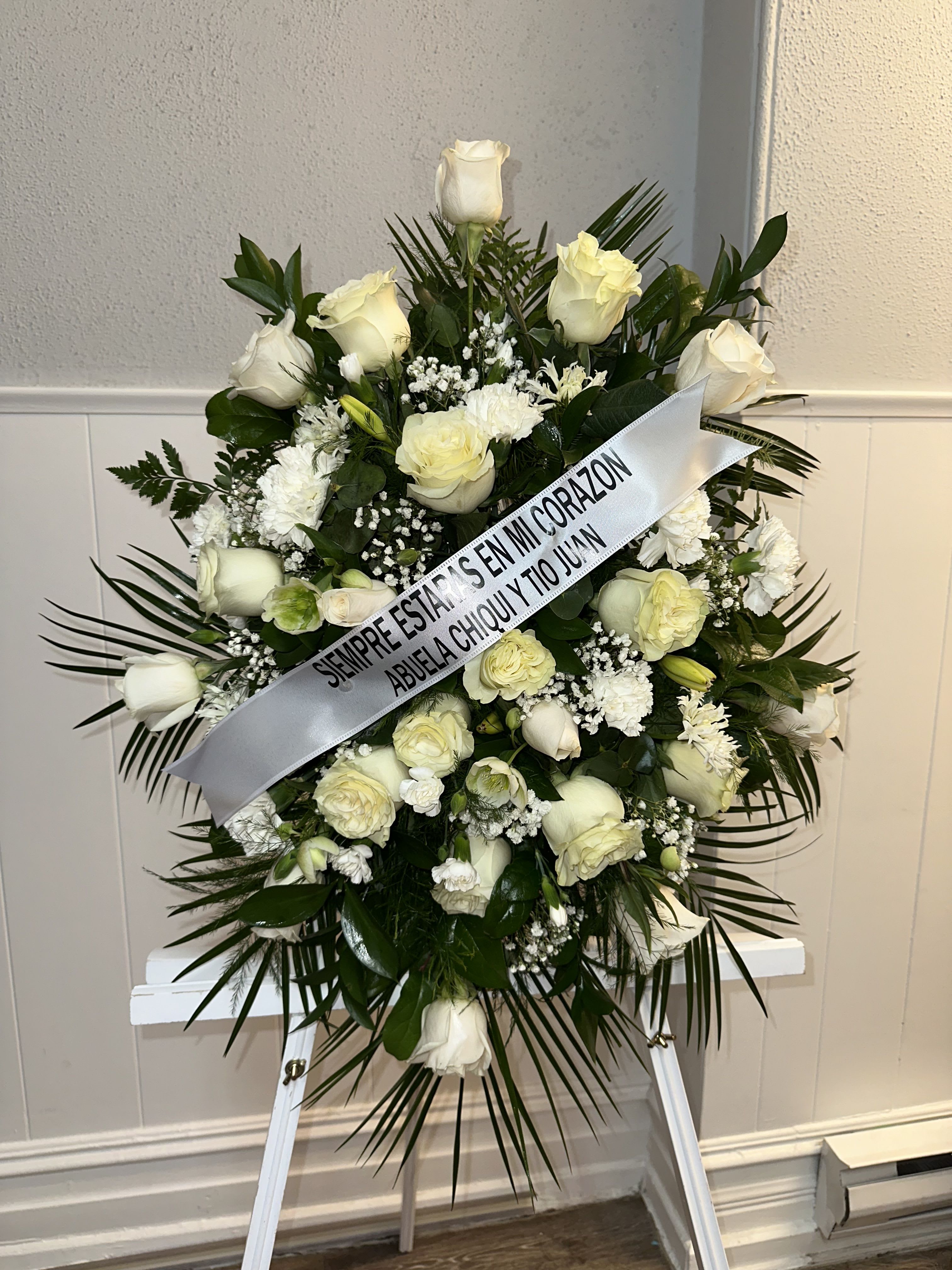 STAN FUNEBRE WITH VARIETIES OF WHITE FLOWERS STAN FUNEBRE WITH VARIETIES OF WHITE FLOWERS - STAN FUNEBRE WITH VARIETIES OF WHITE FLOWERS, RIBBON CAN BE PERSONALIZED WITH A SMALL MESSAGE,(THE WHITE STAND IS ONLY FOR THE PHOTO)