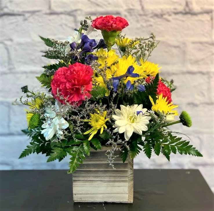 Colorful Meadow Colorful Meadow - This charming arrangement looks like you took a stroll through a beautiful meadow to pick fresh and vibrant blooms!
