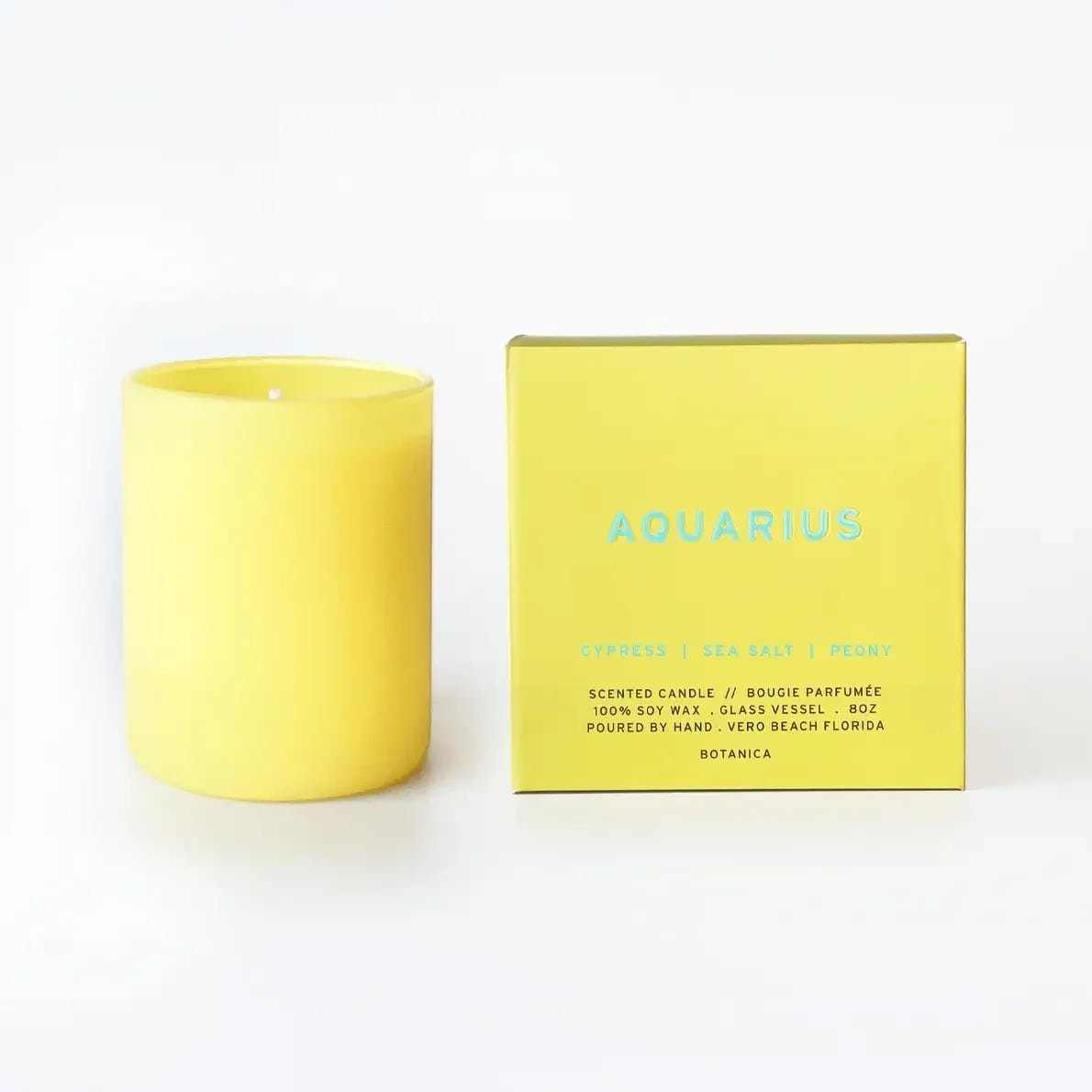 Aquarius Zodiac Candle | 8 oz.  - AQUARIUS  January 20- February 18 A mix of effervescent sea salt and sweet peony is paired with woodsy, cypress notes that give this floral base an earthy freshness.  Fragrance Notes: Cypress, Sea Salt, Peony  • $1 For Good: SAGE, Care for Q+ Elders • 8 oz. Soy Wax Candle | 50 Hour Burn Time