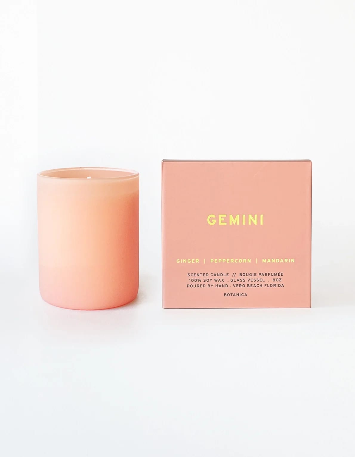 Gemini Zodiac Candle | 8 oz. - GEMINI: May 21 - June 20 Bright and fruit-forward, with a spicy twist, our Gemini pairs juicy mandarin notes with a pop of unexpected peppercorn and ginger to keep you on your toes. Definitely not your basic fruity candle.  Fragrance Notes: Ginger, Peppercorn, Mandarin  • $1 For Good: SAGE, Care for Q+ Elders • 8 oz. Soy Wax Candle | 50 Hour Burn Time