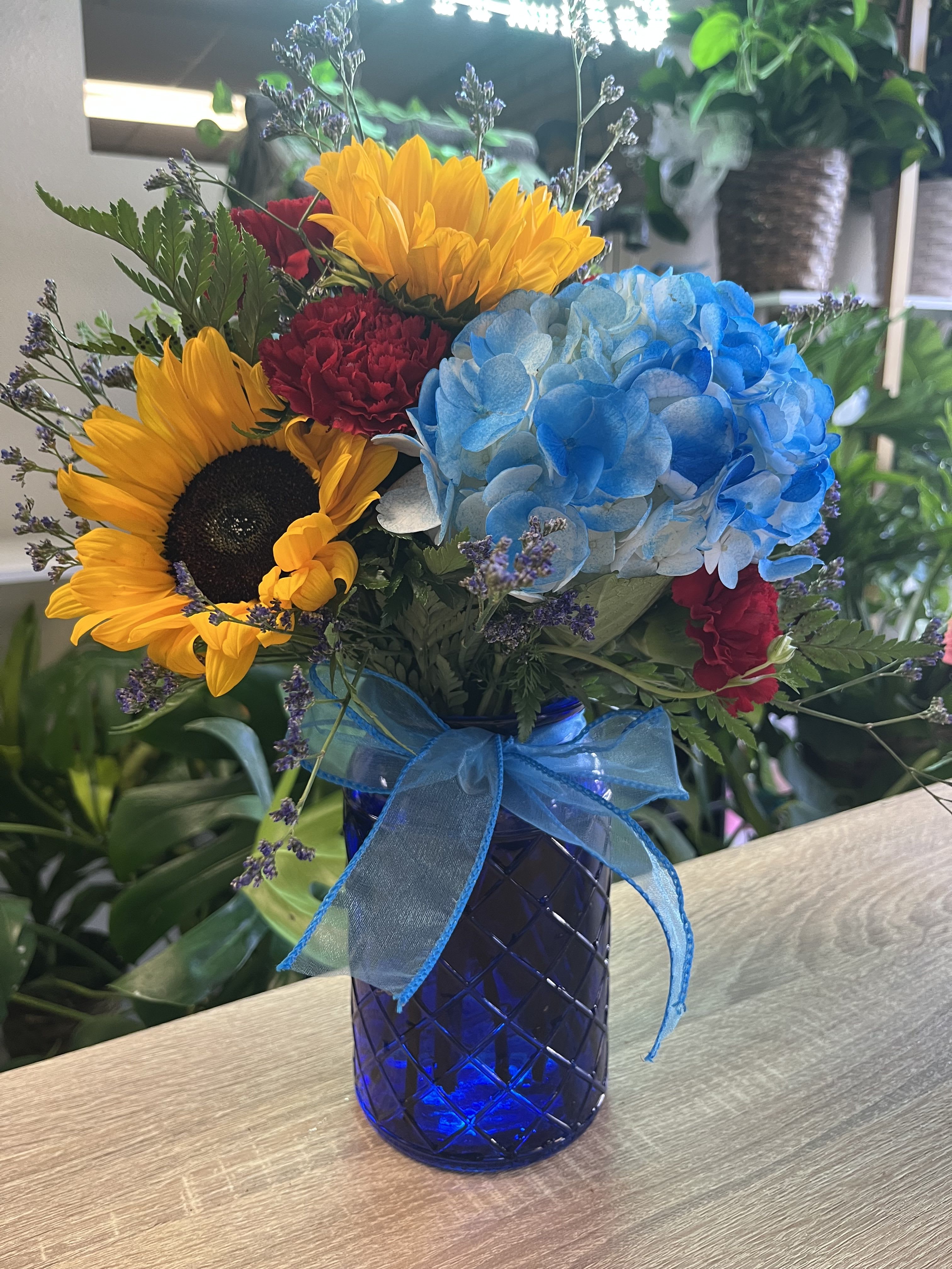 Sunflower Beauty - fresh sunflowers in blue vase 