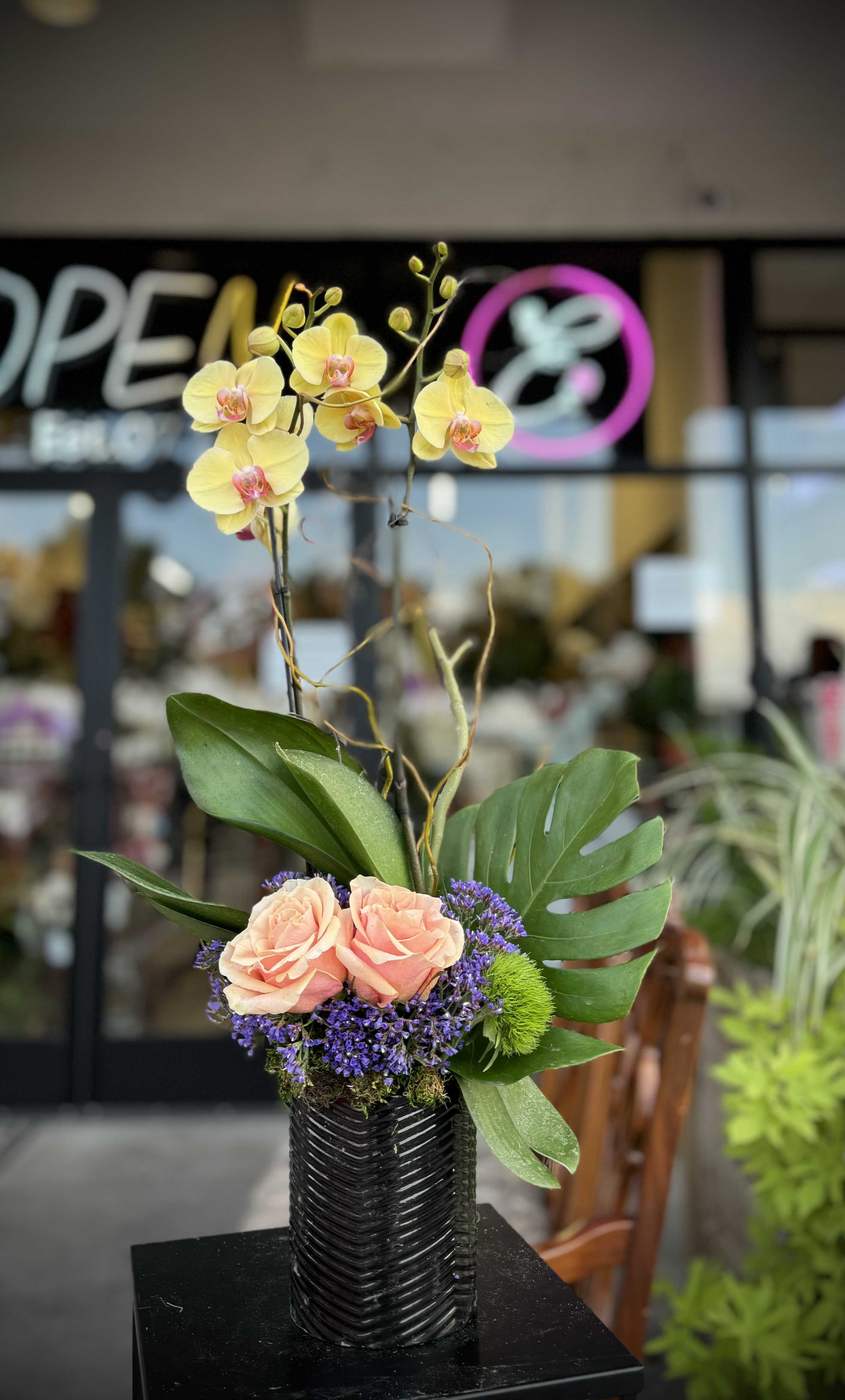 Orchid Arrangement #3 Orchid Arrangement #3 - Custom orchid arrangements feature the exotic beauty and elegance of orchids, tailored to your unique preferences. These striking blooms, known for their sophisticated appearance and can be arranged in various styles to suit any occasion or space.