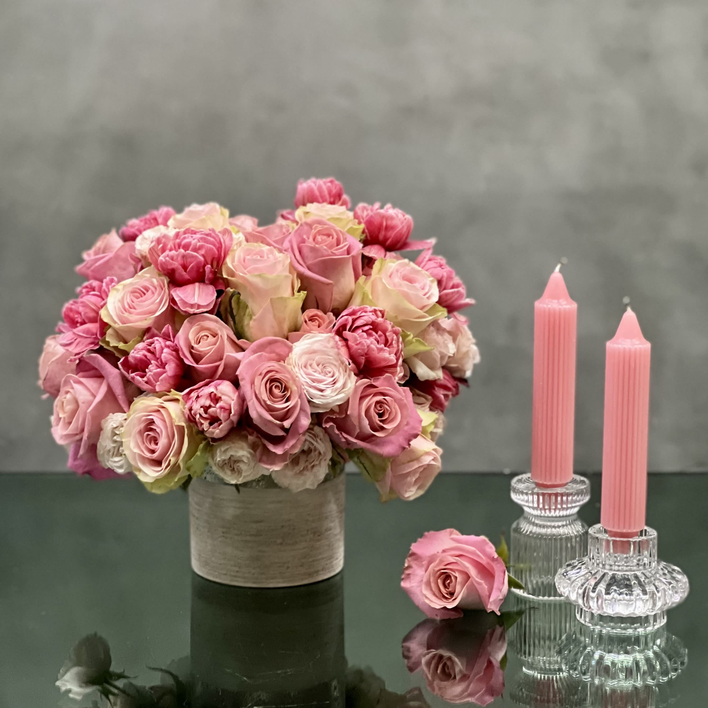 Amour - Our team at Beverly Hills Florist offers same day delivery. Our Amour arrangement is sure to put a smile on anyones face. A little bit of glamour with a whole lot of love! This floral piece includes various shades of pink Roses, pink Tulips placed in a 5x5 vase with silver textures. Beautifully made for, Birthdays, Thank you, Love &amp; Romance &amp; Thinking of you ! Approximately 25 Roses &amp; 12 Tulips. 