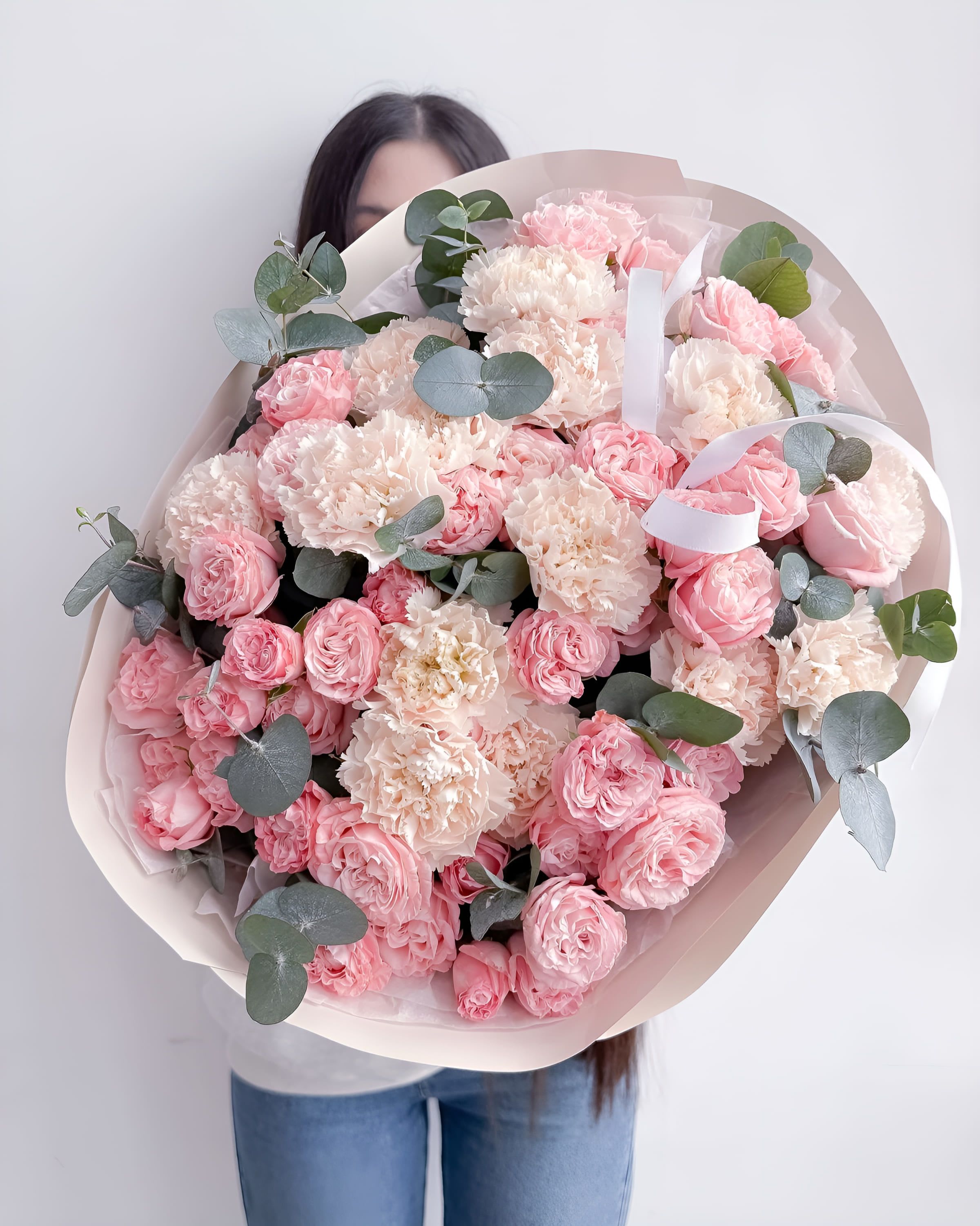 Blush Harmony - A gentle and elegant mix of soft pink garden roses, creamy carnations, and fresh eucalyptus accents. Blush Harmony is a bouquet that speaks in whispers of affection and grace, perfect for expressing warm feelings, celebrating milestones, or brightening someone’s day with timeless beauty.