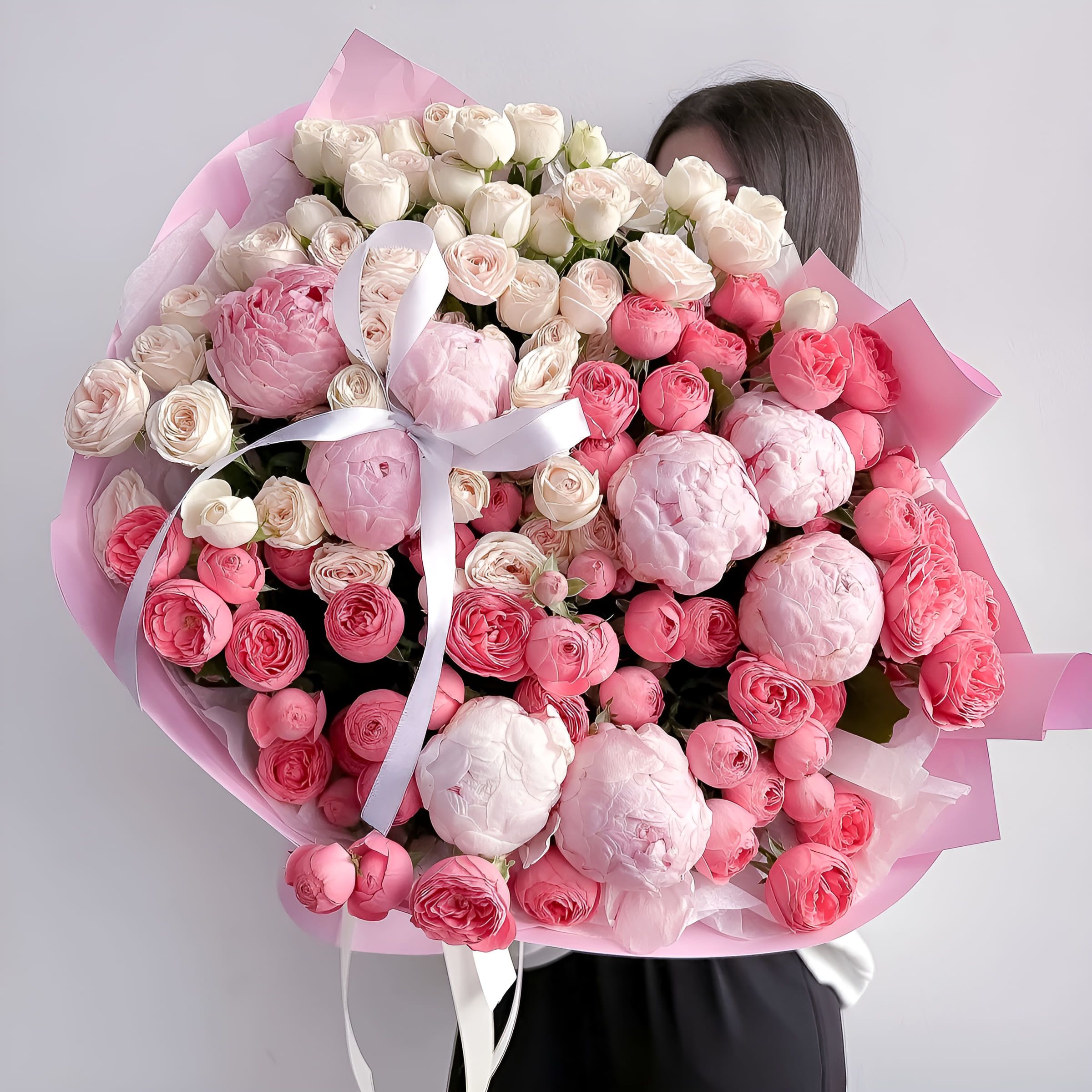 Peony Crush - A luxurious fusion of soft blush peonies, delicate spray roses, and classic garden roses in shades of ivory, pink, and coral. Peony Crush is the ultimate bouquet for those who adore feminine elegance and floral abundance. Overflowing with texture and tenderness, it’s ideal for birthdays, love declarations, or simply to leave someone speechless. Size on the photo: Deluxe.