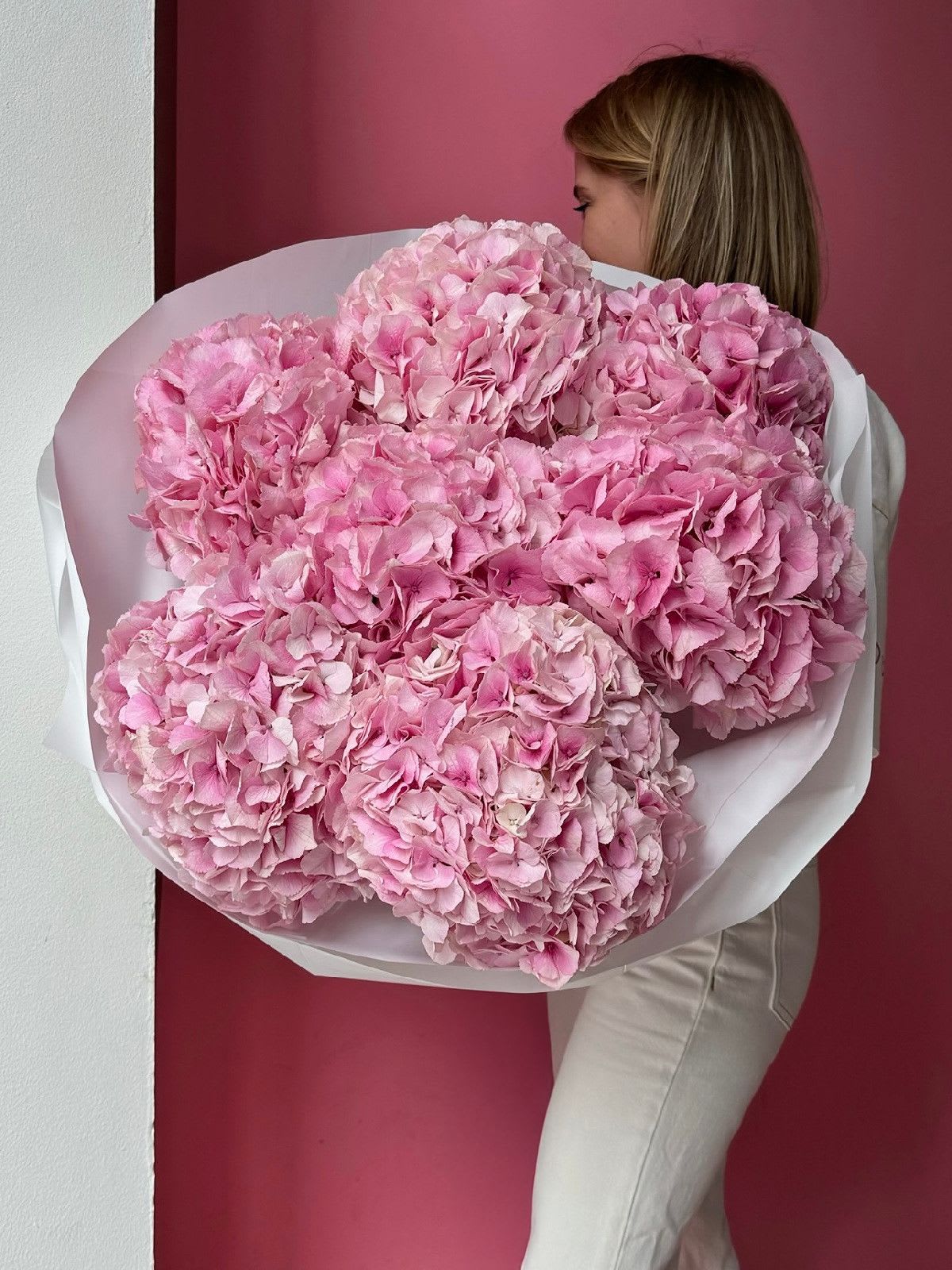 Pink Hydrangea - A stunning bouquet of fresh pink hydrangea, perfect for any occasion. Wrapped in matte film and tied with a ribbon. This elegant arrangement is sure to impress. Delivered in an aqua box for ultimate freshness.
