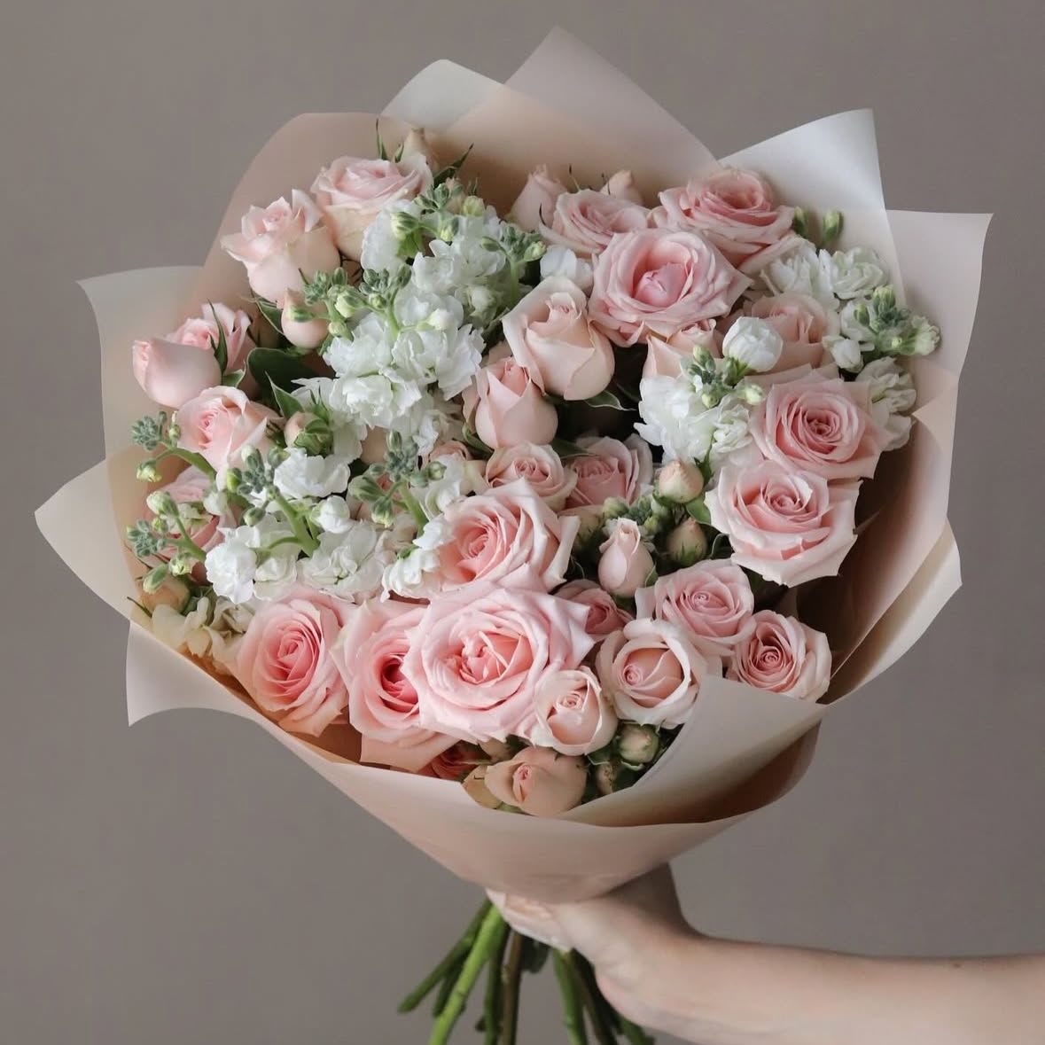 Princess Princess - A cute bouquet of fresh spray roses and stock in pink and white colors, perfect for any occasion. Wrapped in matte film and tied with a ribbon. This elegant arrangement is sure to impress. Delivered in an aqua box for ultimate freshness.
