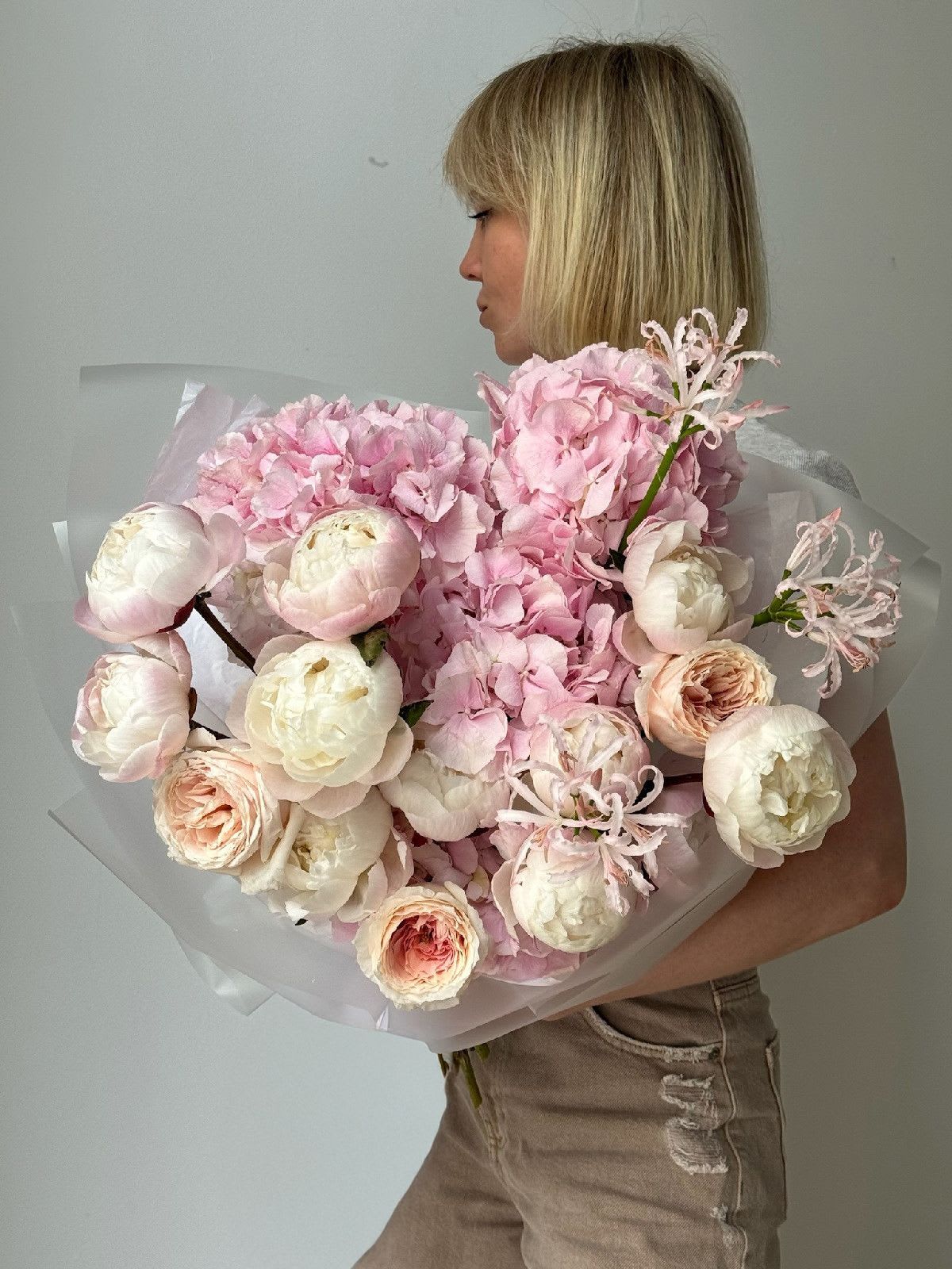 Roses &amp; Peonies - A lush and expressive bouquet featuring garden roses, peonies, hydrangeas, and delicate nerine stems. This elegant blend brings together the romantic fullness of peonies, the refined charm of hydrangeas, and the graceful lines of nerine. A perfect choice to express affection, warmth, and beauty in one harmonious floral composition.  