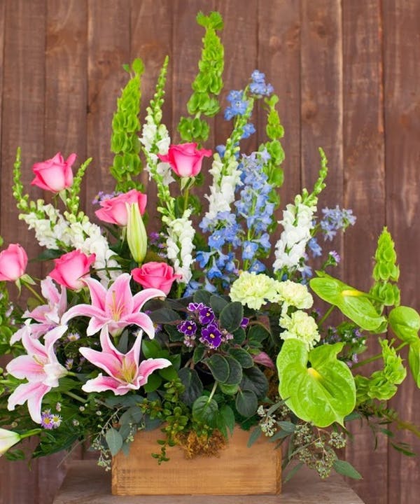 Amazing Grace Amazing Grace - A beautiful collection of garden flowers in a rustic wooden box is the perfect tribute for your loved one.