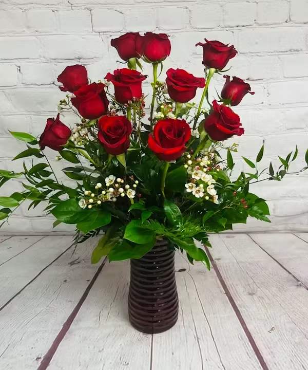Dozen Red Roses Dozen Red Roses - One dozen of the finest Ecuadorian roses carefully hand selected and arranged in all their natural beauty in a glass vase.