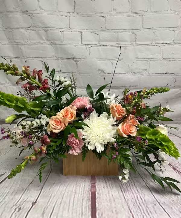 ROYAL PEACH ROYAL PEACH - This arrangement features elegant spray roses, lisianthus snapdragons, chrysanthemums, and other gorgeous blooms.