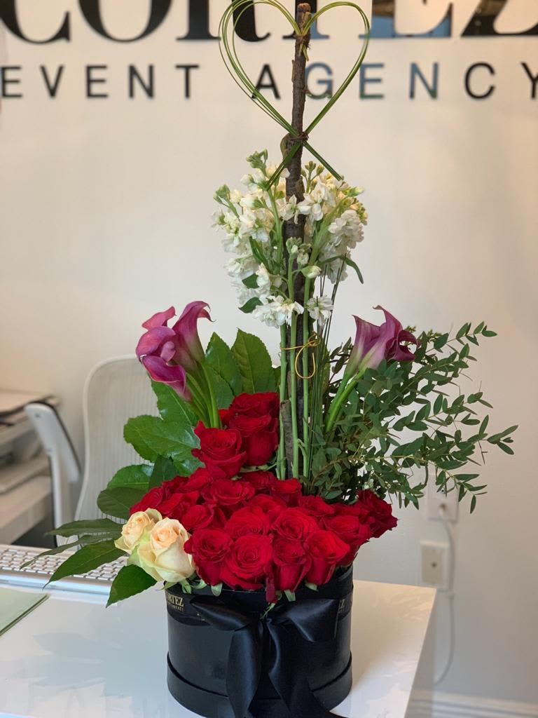 Green Heart Arrangement with Red &amp; White Roses and Sweet Peas - Beautiful green heart arrangement featuring vibrant red and white roses, complemented by fragrant sweet peas. A unique and romantic floral design perfect for expressing love and affection on any special occasion. Order this stunning arrangement today!