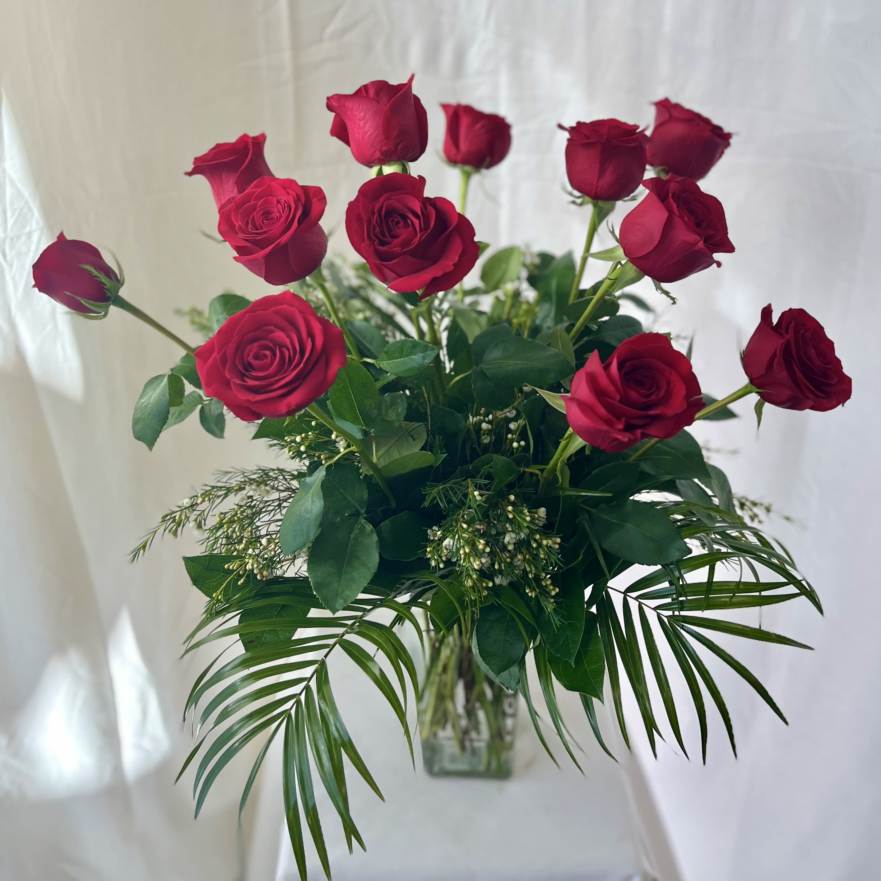 Truly Yours Roses - Roses, Roses, Roses!!! A well curated statement of love professionally designed in a traditional style.  This design of roses is a beautiful celebration of love for that special person in your life.  Trully Yours is available in 12, 18 &amp; 24. For an even bigger impact, see our Never Ending Love for 36 Red Roses 