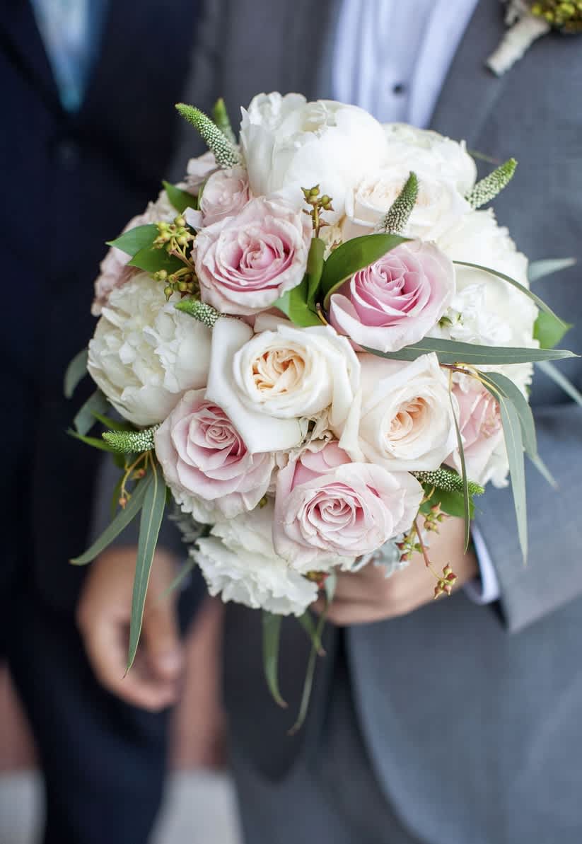 Bridal bouquet  - Peonies, roses, and eucalyptus with other premium accents in a hand tied bouquet