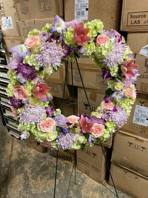 Pinks and Purples Wreath  - A large wreath filed with roses, lilies and other accent flowers in Purple and pinks 