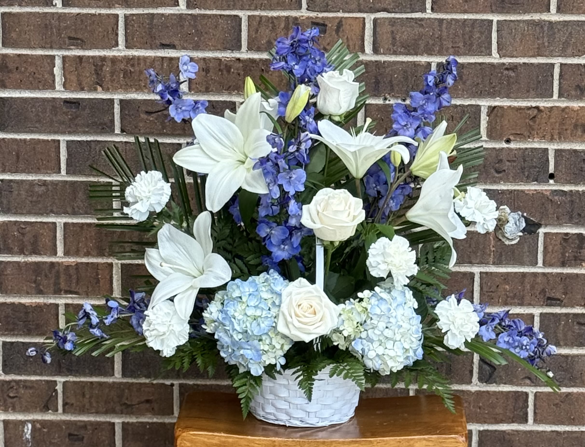 Bountiful Basket  - Blue Delphinium, White carnations, White Lilies, Roses , Blue Hydrangea and greens 