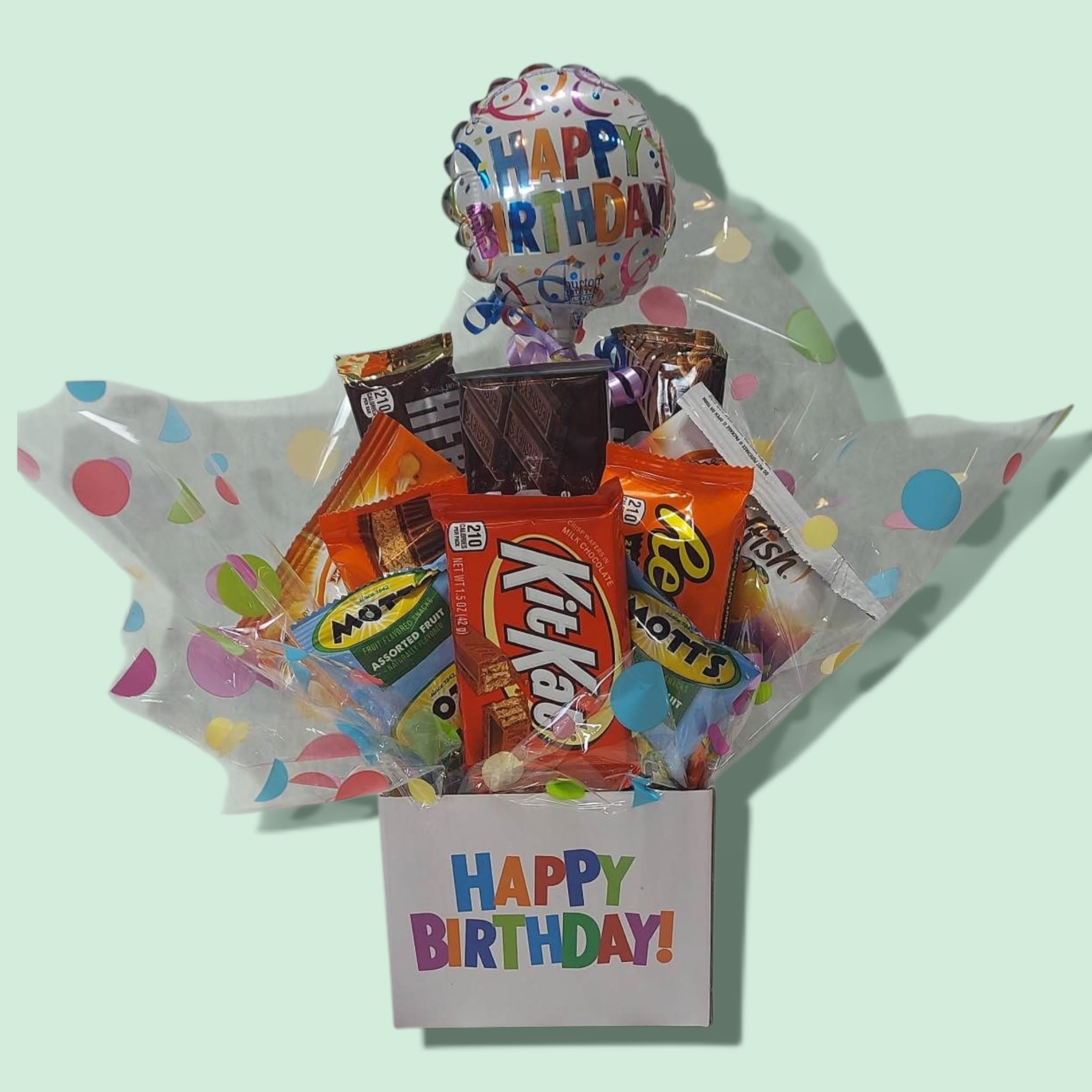 Happy Snacky Birthday Box Happy Snacky Birthday Box - A delightful gift for anyone, our Happy Snacky Birthday Box will bring joy to all! A mixture of popular candy bars, goldfish crackers, and gummies is festively displayed in our happy birthday box and topped with a 4" mylar stick balloon. Approximately: 6 bars, 2 crackers, and 2 gummies