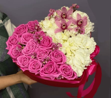 Pink Orchid Heart Box - Our Pink  Heart Box is a romantic and luxurious arrangement crafted in a heart-shaped box. Filled with rich fuchsia roses, delicate white blooms, and elegant cymbidium orchids, this floral design is a beautiful way to express deep love and admiration.  Perfect for anniversaries, Valentine’s Day, birthdays, or simply to say “I love you,” this arrangement blends beauty and emotion into one unforgettable gift. Available for delivery throughout Los Angeles.