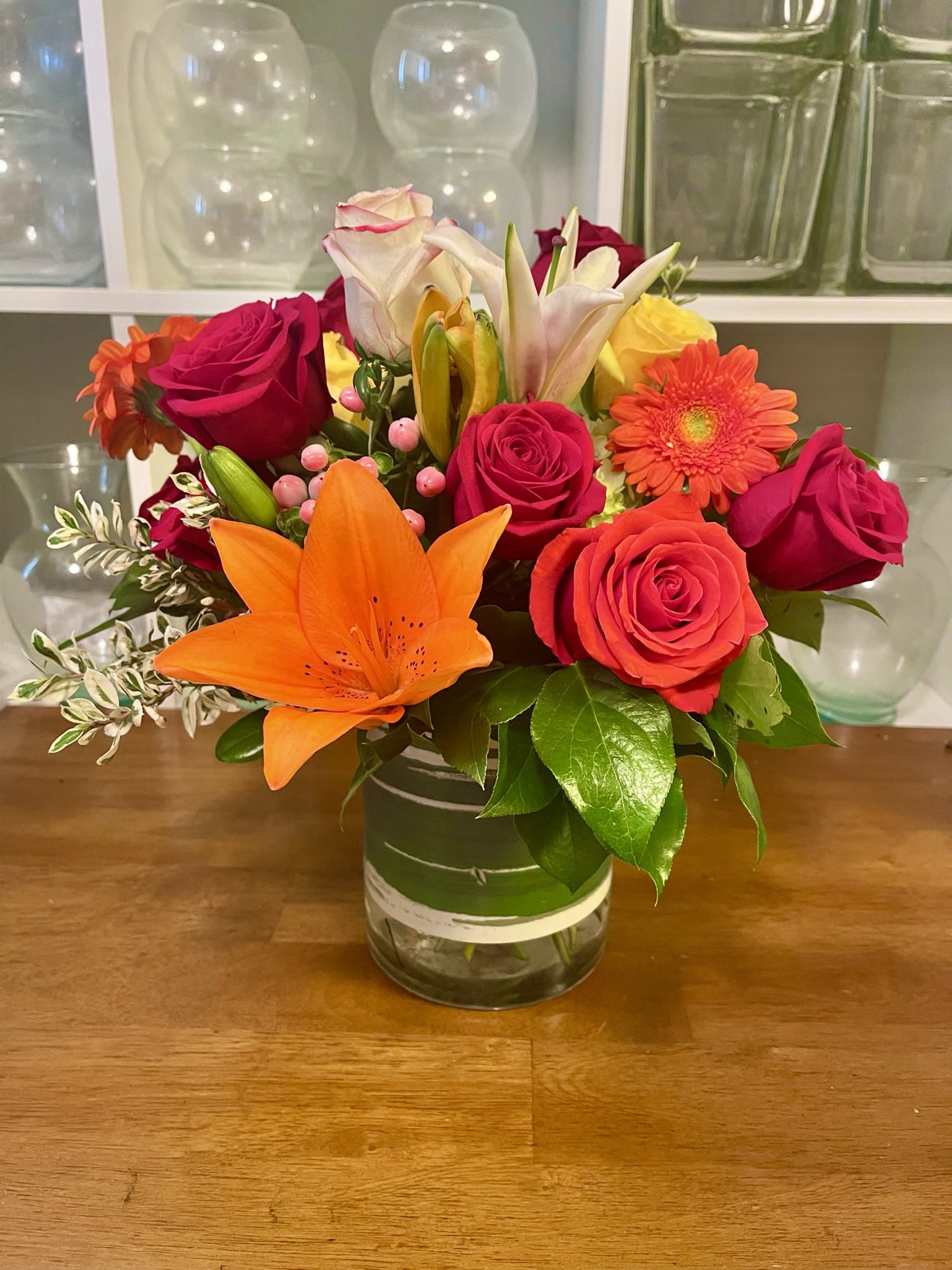 Autumn Vibes Autumn Vibes - A beautiful arrangement of fresh cut flowers in a cylinder vase.