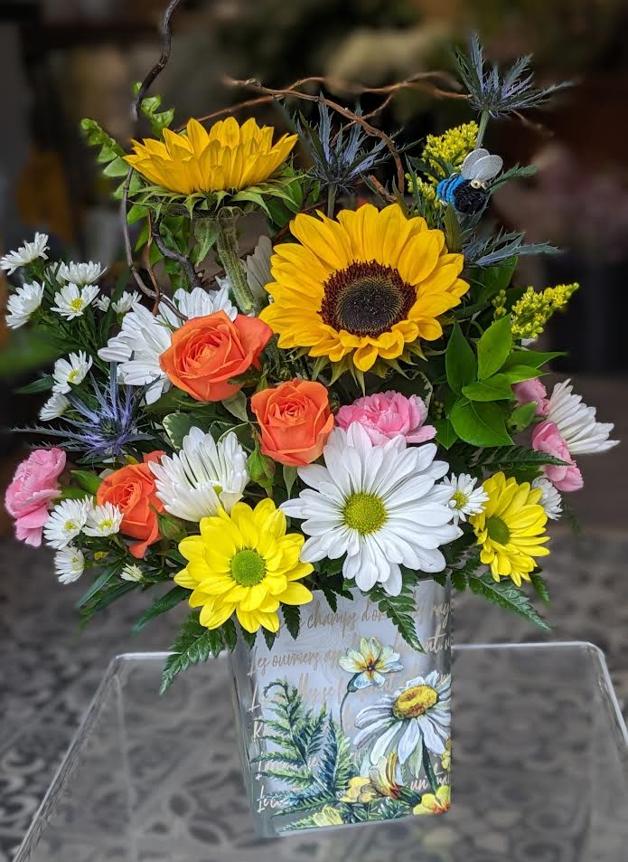 Daisies in the Sun (Designer Choice) Daisies in the Sun (Designer Choice) - What could be sweeter than a vase with cheerful yellow sunflowers and white daisies? Can't think of anything? Then choose this sunny bouquet. It will brighten their day. All Around 12Wx15H