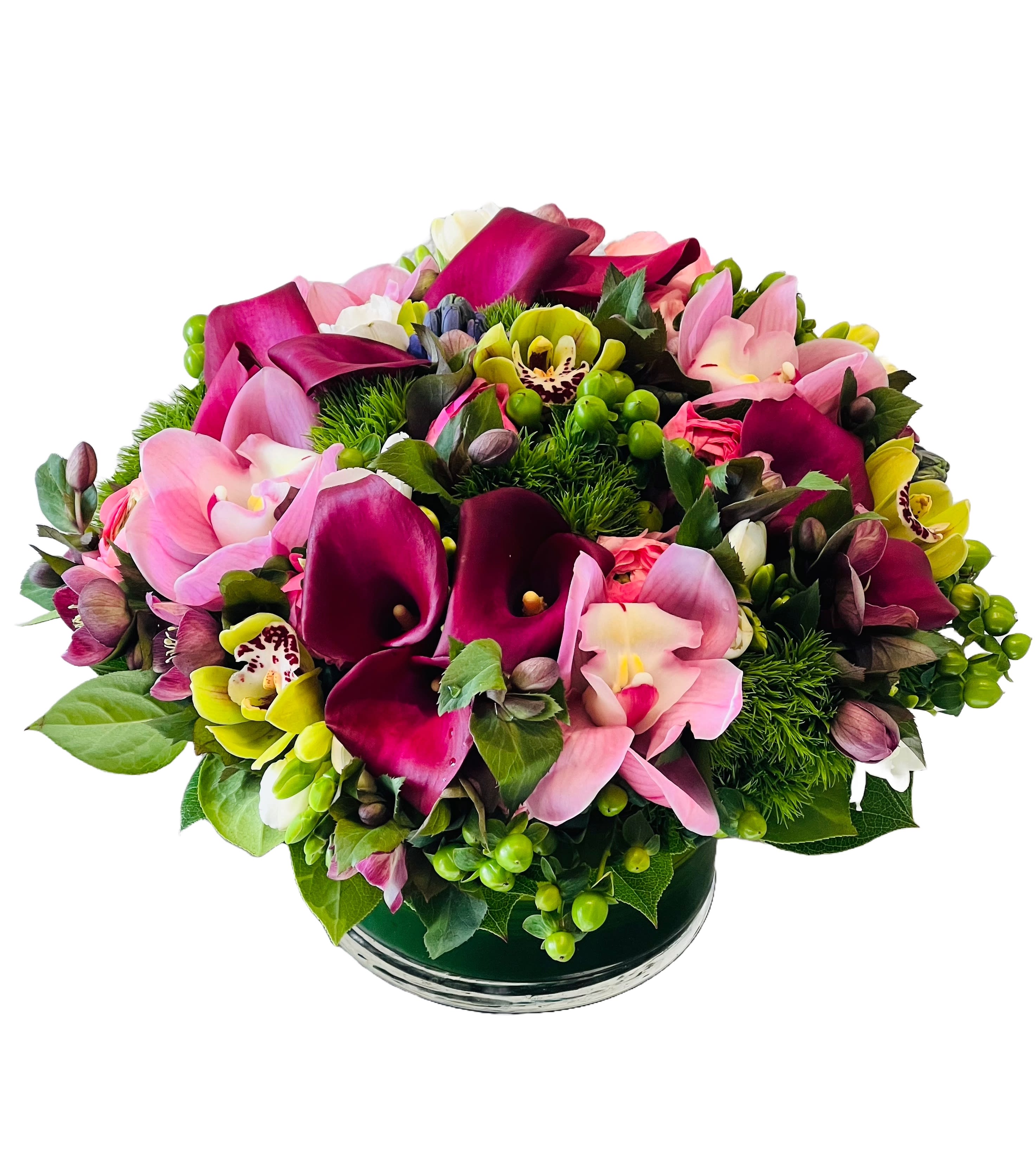 Enchanting - This enchanting arrangement is a combination of romantic pinks curated to captivate hearts. This elegant ensemble features an array of delicate blooms in shades of blush, rose, and soft pink, intertwining to create a tender and elegant expression of love. Delight your beloved with this captivating arrangement, where each blossom whispers tales of affection and tenderness, evoking the spirit of a cherished romance.