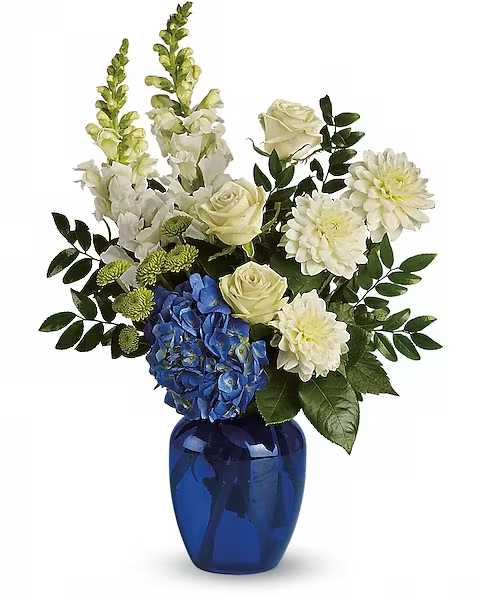 Ocean Devotion - Sending this brilliant blue and white bouquet will surely garner oceans of appreciation from whoever receives it.  Dazzling blue hydrangea, green roses and button spray chrysanthemums, divine white dahlias and snapdragons plus huckleberry arrive in a striking cobalt vase