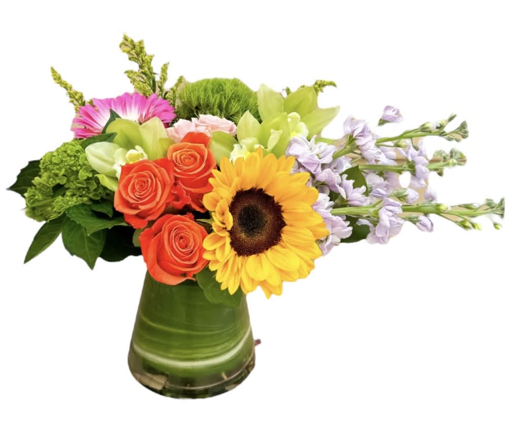Bright Summer  - Orange roses, yellow sunflower, stock, green cymbidium orchids, pink gerbera daisy, green hydrangea, dianthus, pink spray rose, and yellow aster designed in a glass vase as shown. 