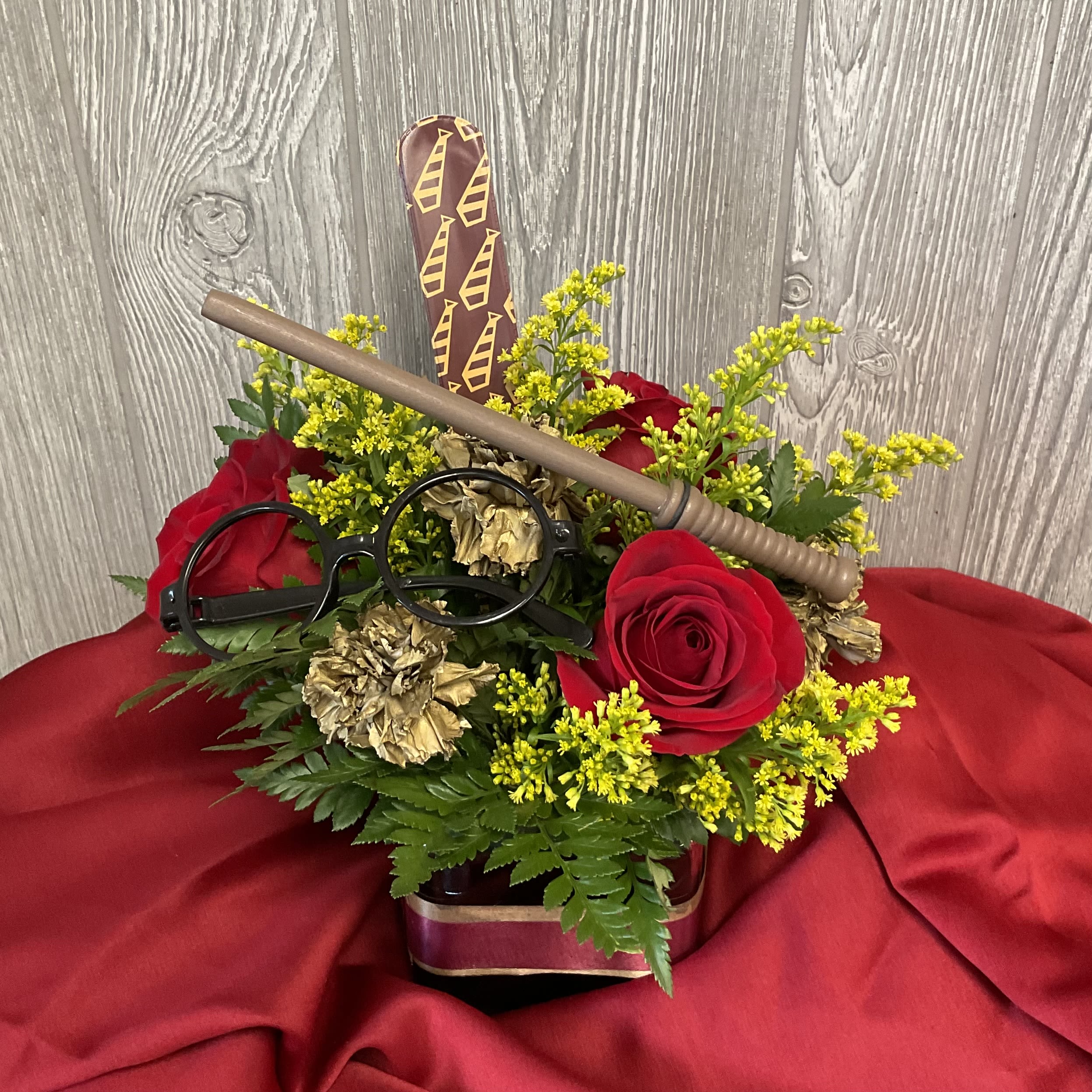 Epic Gryffin - Send the magical gift of fresh cut flowers to your brave and courageous companion.  Flowers and inclusions may vary. 