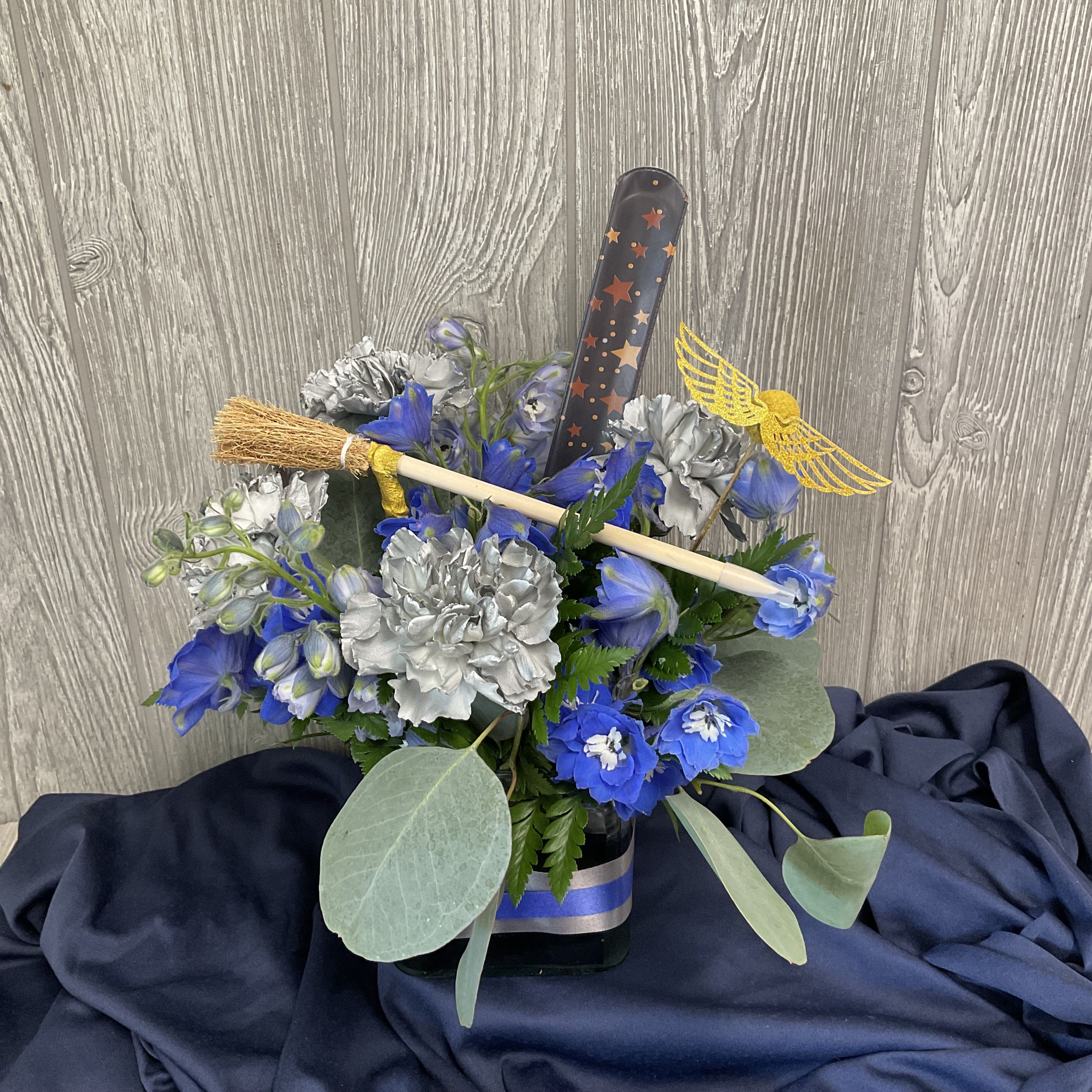 Epic Raven - Send the magical gift of fresh cut flowers to your wise and creative companion.  Flowers and inclusions may vary. 