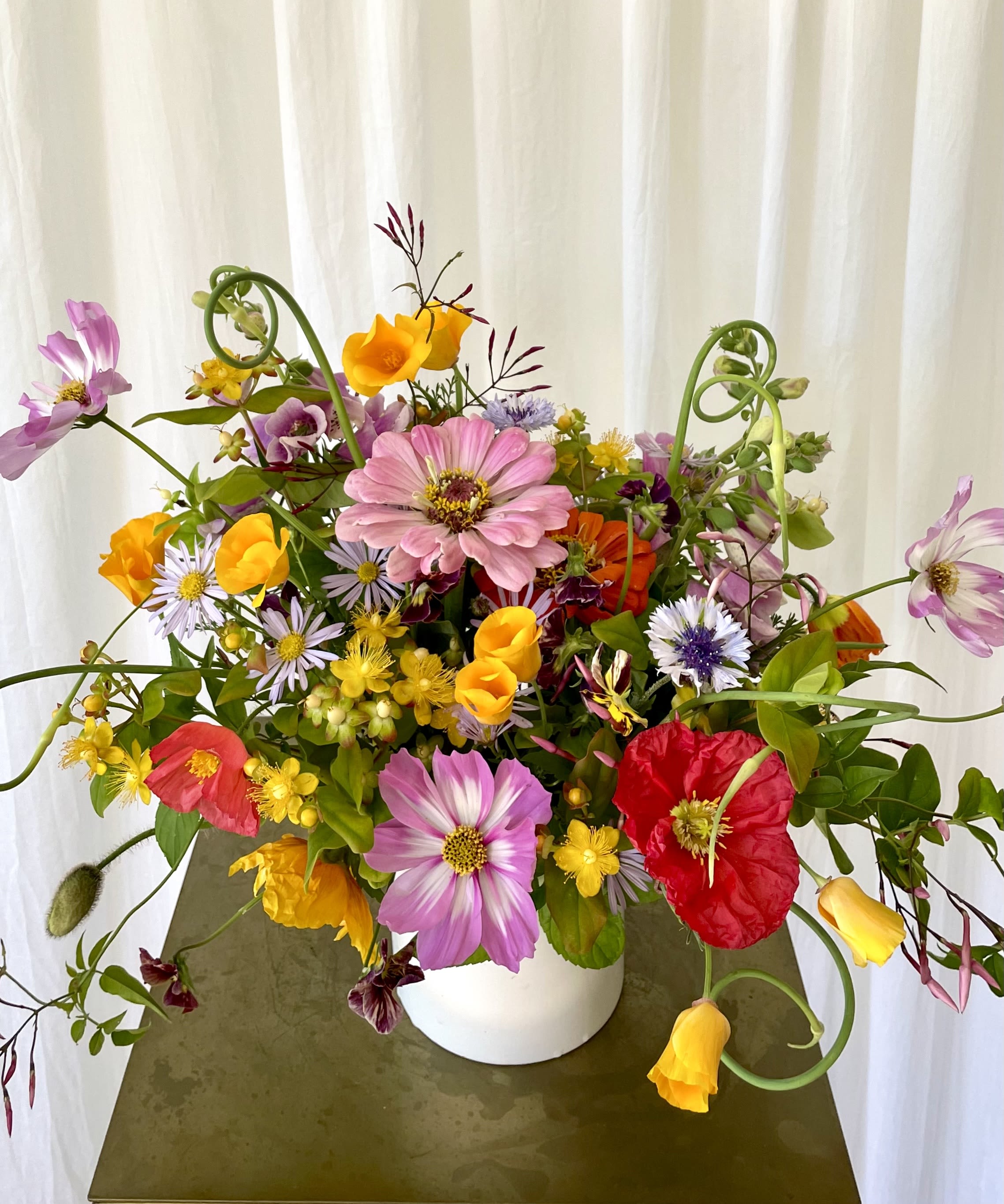 &quot;Artist's Choice&quot; MEDIUM - Our absolute most eclectic selection. We use the most unique, wild, and sculptural pieces that week and create a work of art! Your arrangement will not be the same as the one pictured, instead it will be different colors, different flowers, completely seasonal and fresh, and also uniquely yours! If you trust us, let us run free!  Concerning Seasonality: As a seasonal, locally-focused florist, we have different product to work with each week. Our focus is on creating a unique piece for each customer, with blooms that are fresh from local farms and growers. While the flower varieties and colors may vary, the quality and freshness will always be the best. It is an honor to have our customers' trust and confidence in our abilities and artistic eye.   Delivery Policy (PLEASE READ): Pick-ups at the studio are available after 2pm. Our daily delivery time frame is typically between 12- 5 PM. Please specify if you require a certain delivery time and we will do our best to accommodate it, or we will call you if we cannot.   We gently ask that those ordering flowers for someone else to please check first if the recipient of the flowers will be home during that time. Additionally, please be sure to include whether or not there is a gate we may need a code for. If there is no answer at the door, our delivery person will leave the flowers by the doorstep in a weather safe location. Completing your order acknowledges that you have read and understand our delivery policies. 