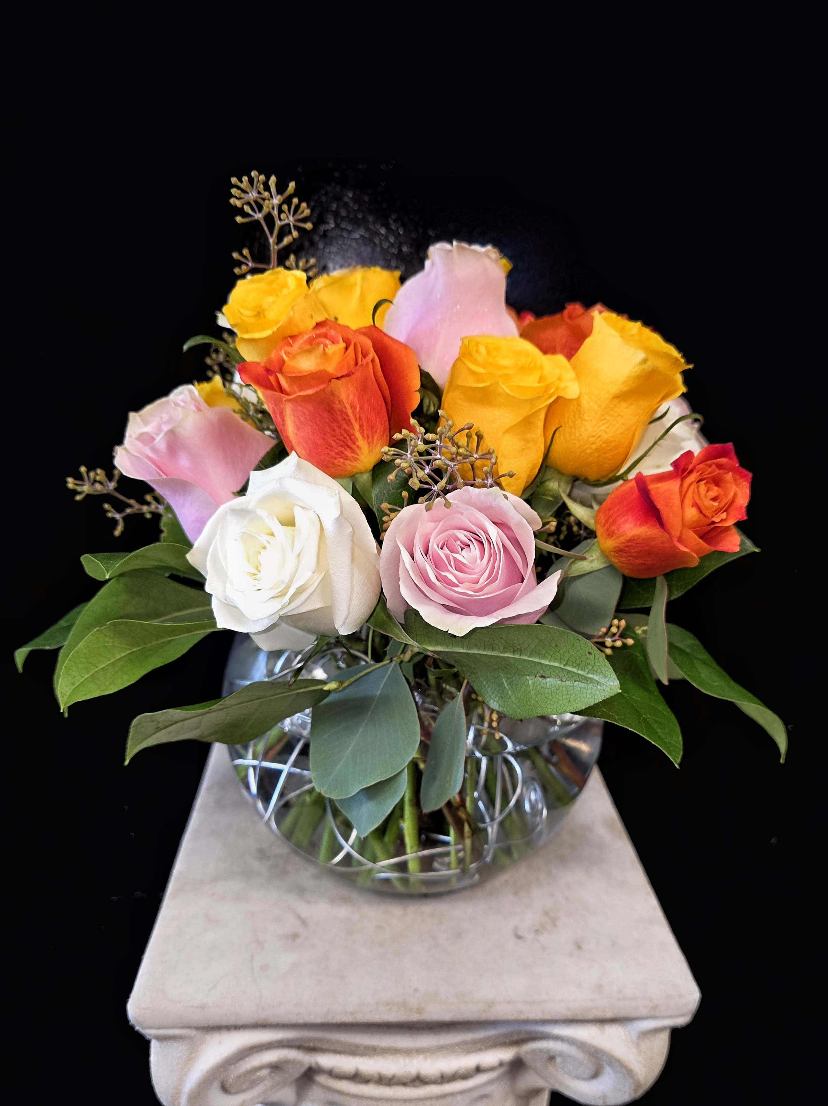 Summer Rose Sunset - Summer Rose Sunset; a beautiful, vibrant Sunset colored arrangement of Roses in a bubble bowl . This lovely arrangement is available in two sizes; 1 dozen roses, and 2 dozen roses