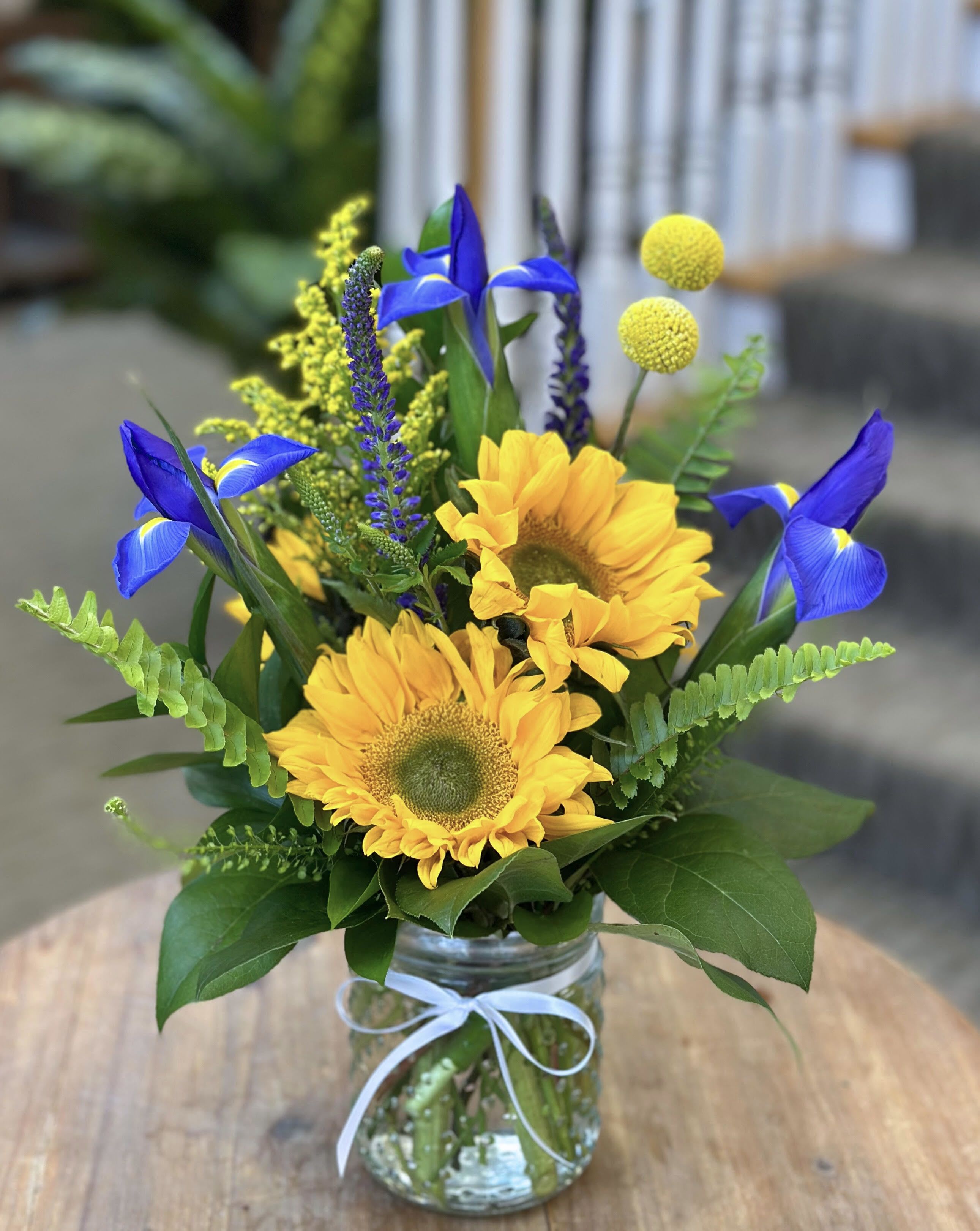 Sweet Daydream - LOCAL DELIVERY ONLY!! A refreshing mix of sunflowers, iris, solidago, veronica, billy balls and greenery designed in a small hobnail vase.